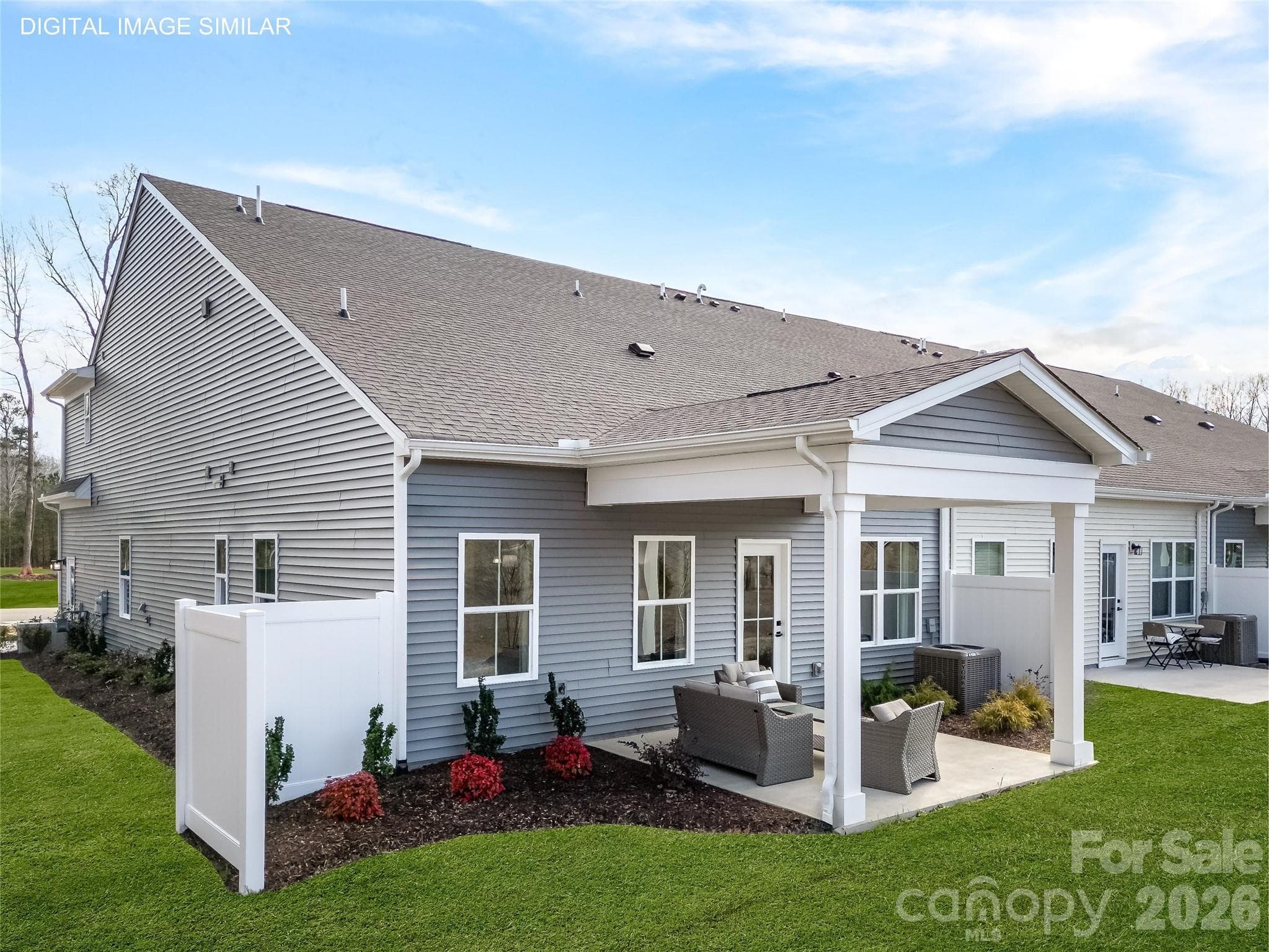 Optional covered rear patio with private divider is ideal for relaxing or entertaining with low-maintenance outdoor living. - Charlotte