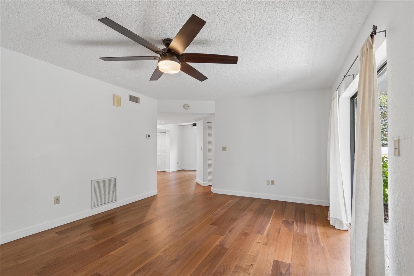 Living Room showing Patio Sliders - 11800 PARK BLVD #401, SEMINOLE