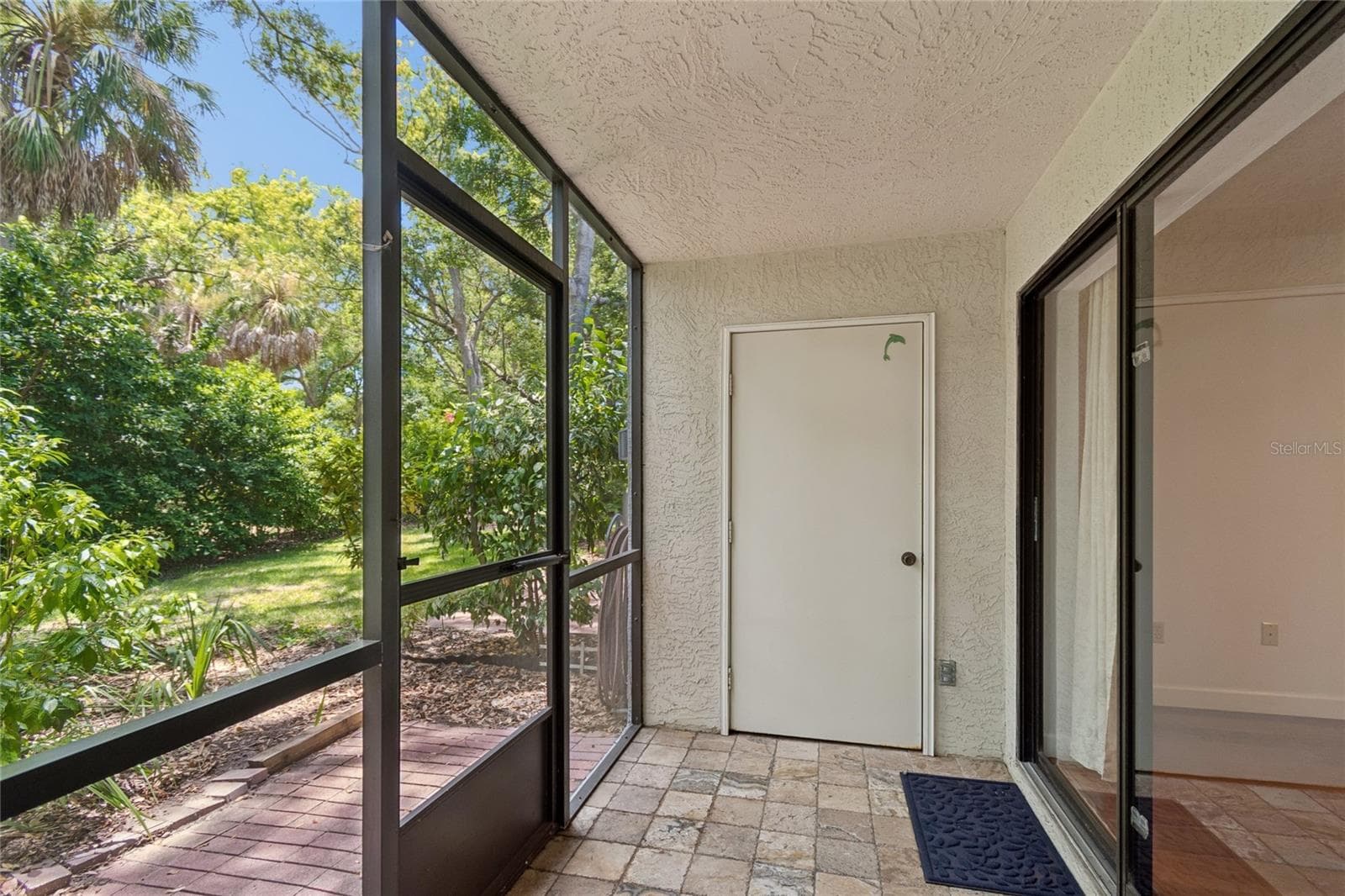 Screened Patio View from Bedroom - 11800 PARK BLVD #401, SEMINOLE