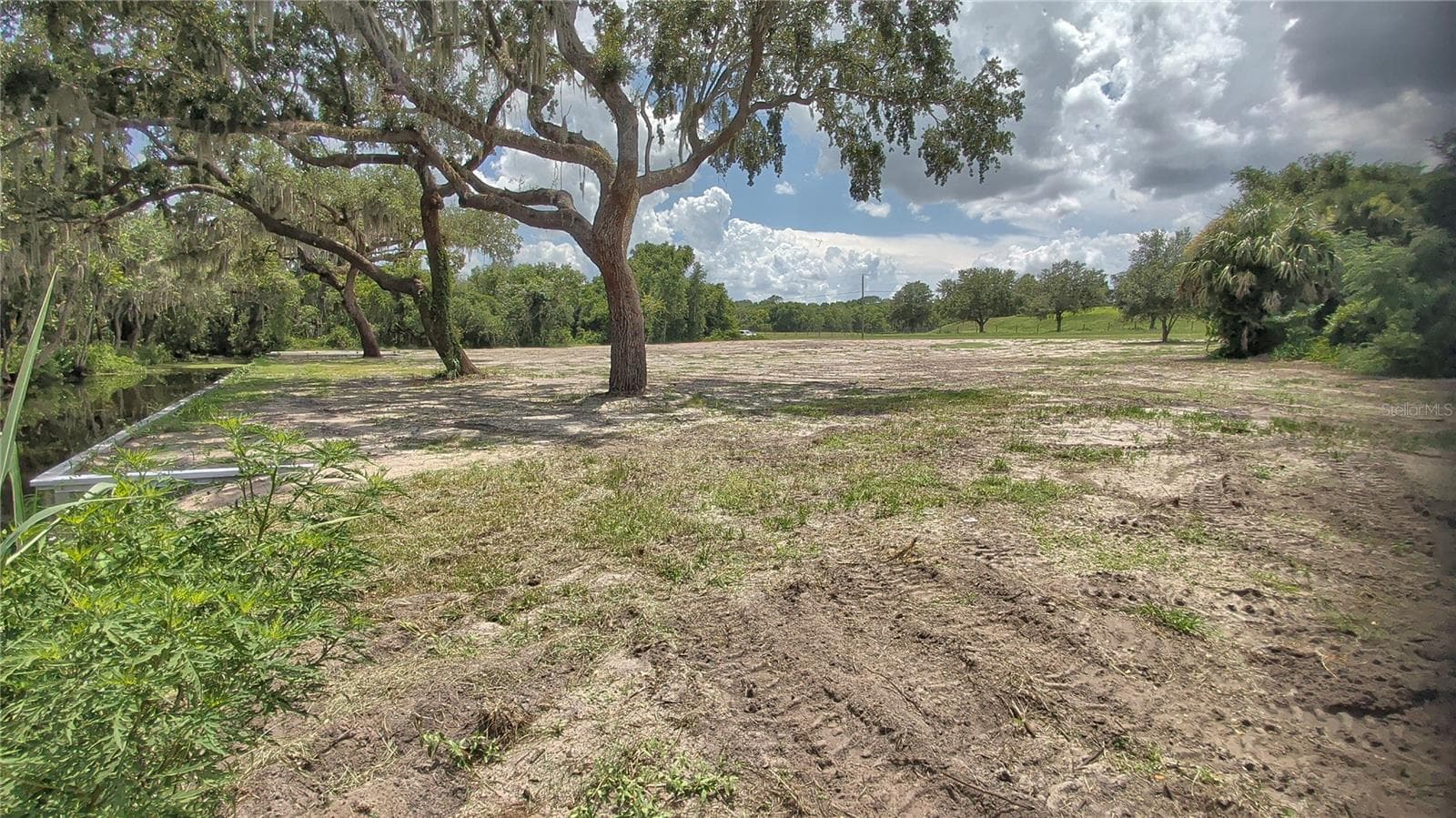 View of cleared property from far canal-side corner of lot - SULEN RD, LADY LAKE