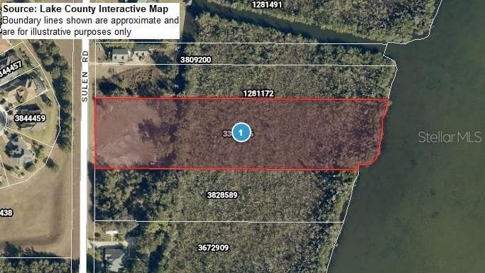 Lake County-sourced imagery of property boundaries showing cleared area, canal, wetland, and lake - SULEN RD, LADY LAKE