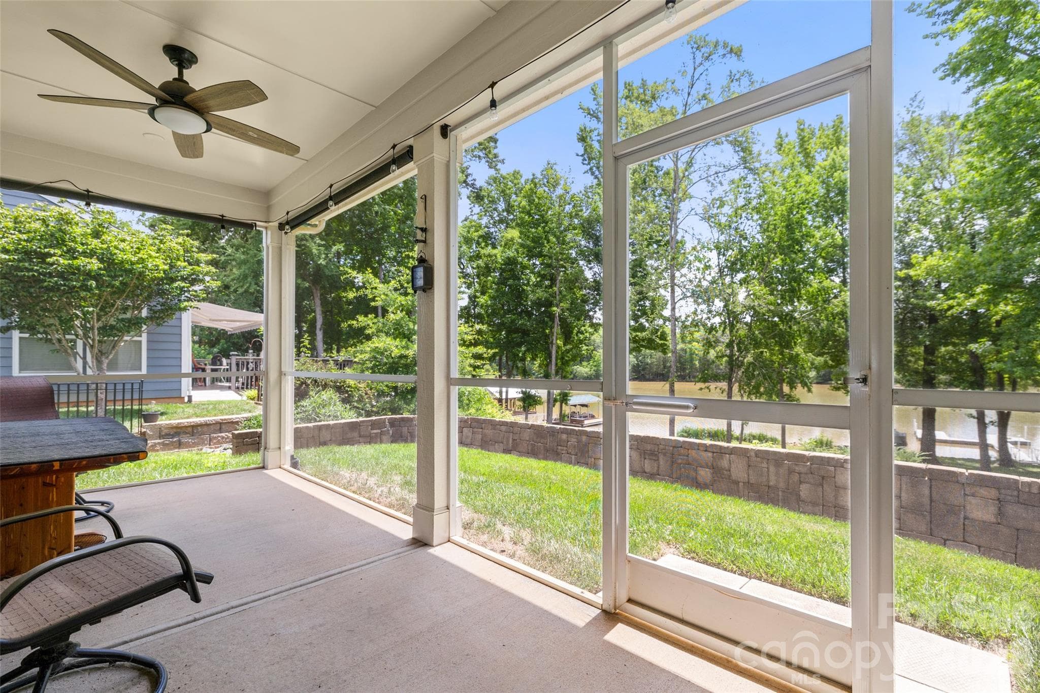 Screen porch overlooking dock - 25566 Seagull Drive, Lancaster