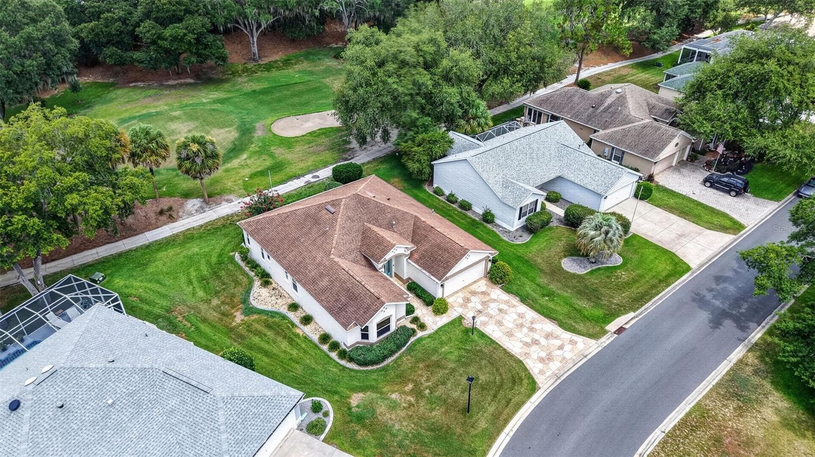 Aerial Front and Side Elevation with Amazing Golf Front Views! - 522 LOMA PASEO DR, THE VILLAGES