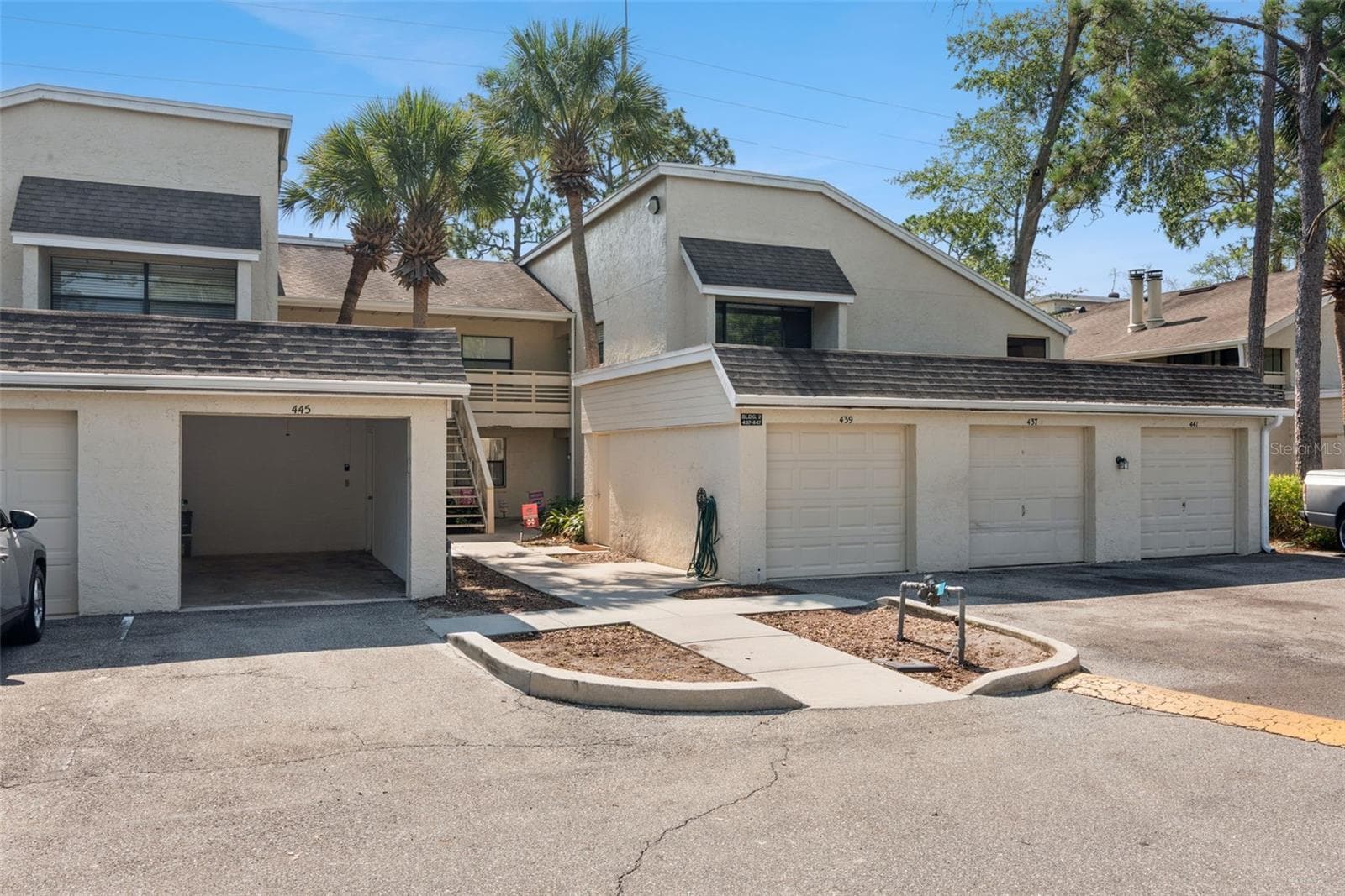 1 car garage with remote opener and a side entry door to access - 445 S NETHERWOOD CRES #2, ALTAMONTE SPRINGS