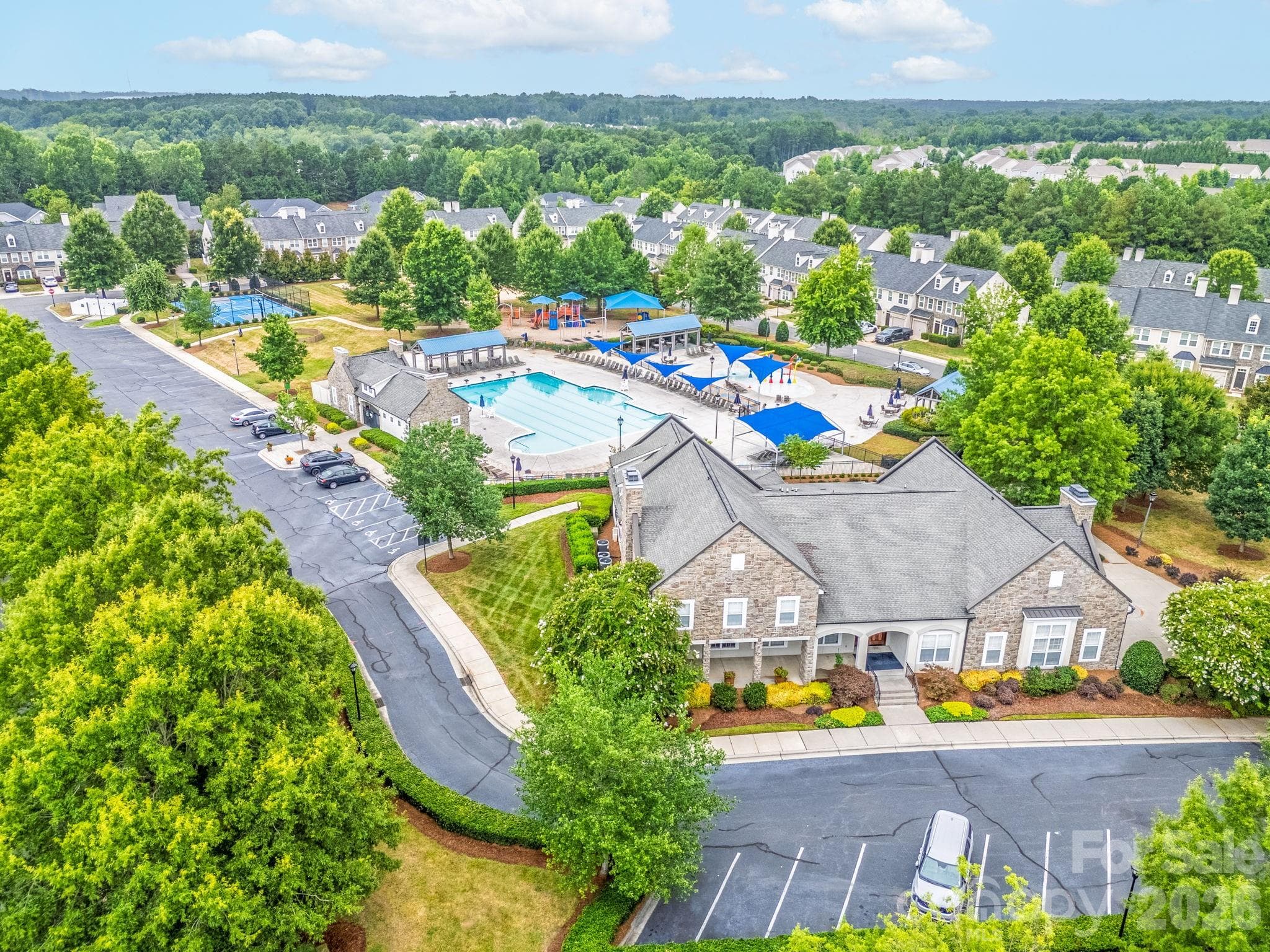 Residents enjoy an exceptional collection of amenities, including a resort-style pool, clubhouse, fitness center, tennis courts and more. - Charlotte