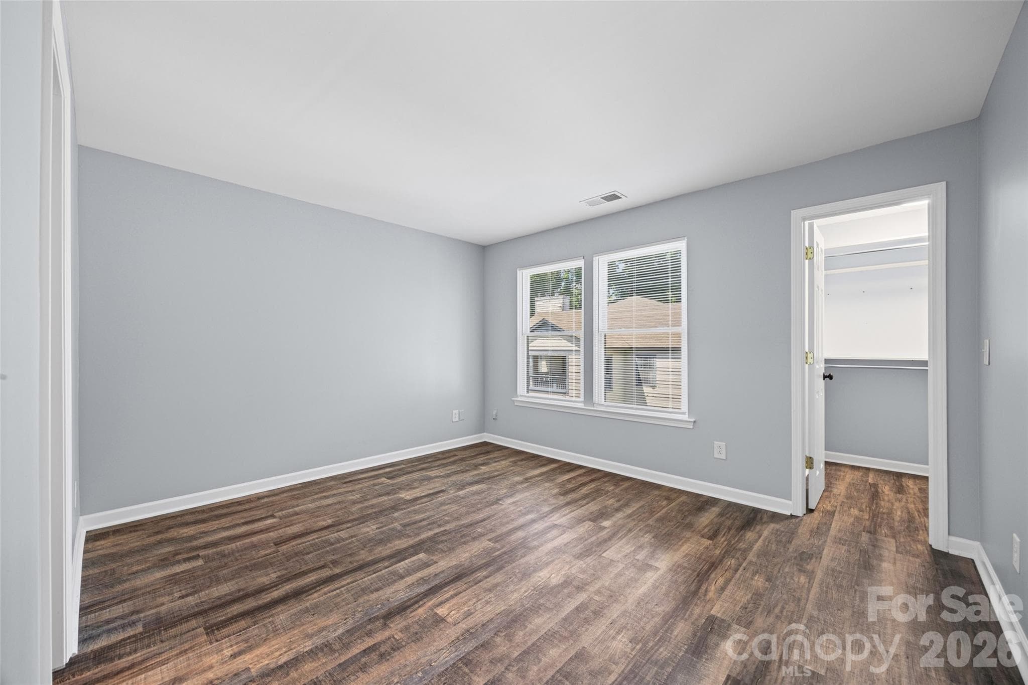 Primary Bedroom with a large Walk-in Closet and a smaller closet - 8119 Tremaine Court, Charlotte