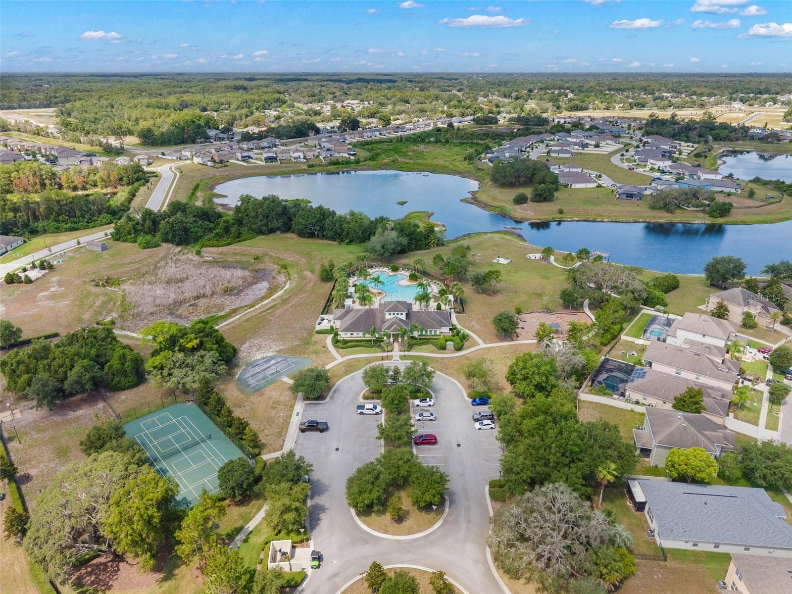Community clubhouse, basketball court, tennis court, playground and pool - 13627 CREST LAKE DR, HUDSON