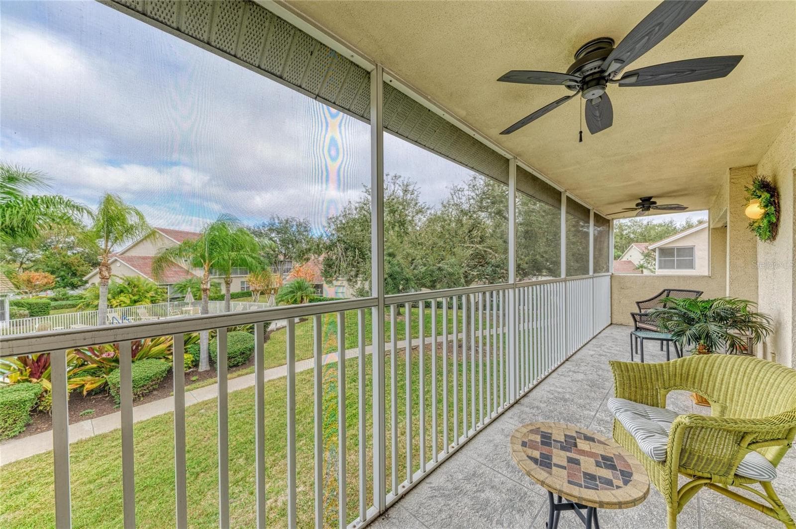 Balcony overlooks community sidewalk walking path - 6821 FAIRVIEW TER #6821, BRADENTON