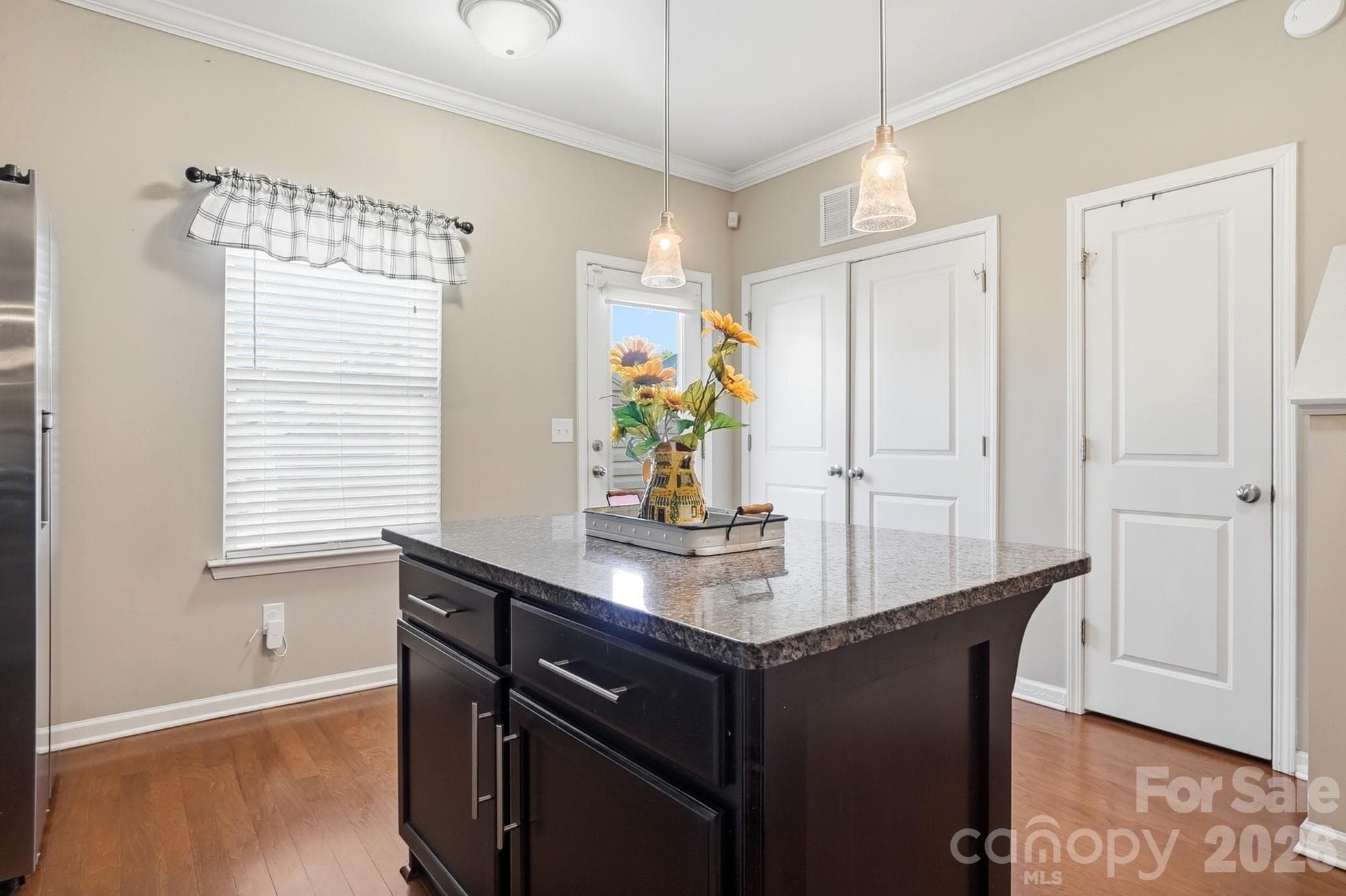 Center island adds extra prep space, storage and casual seating. - 11608 Galashiels Drive, Huntersville