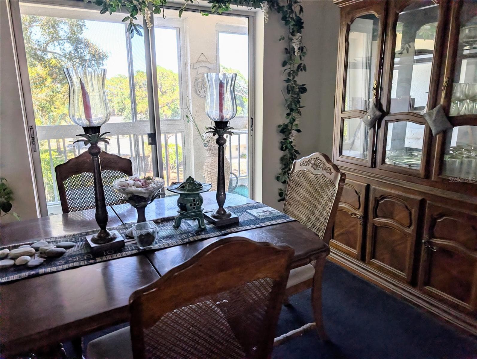 Dining room with quiet view of enclosed lanai - 3714 LAKE BAYSHORE DR #K-418, BRADENTON