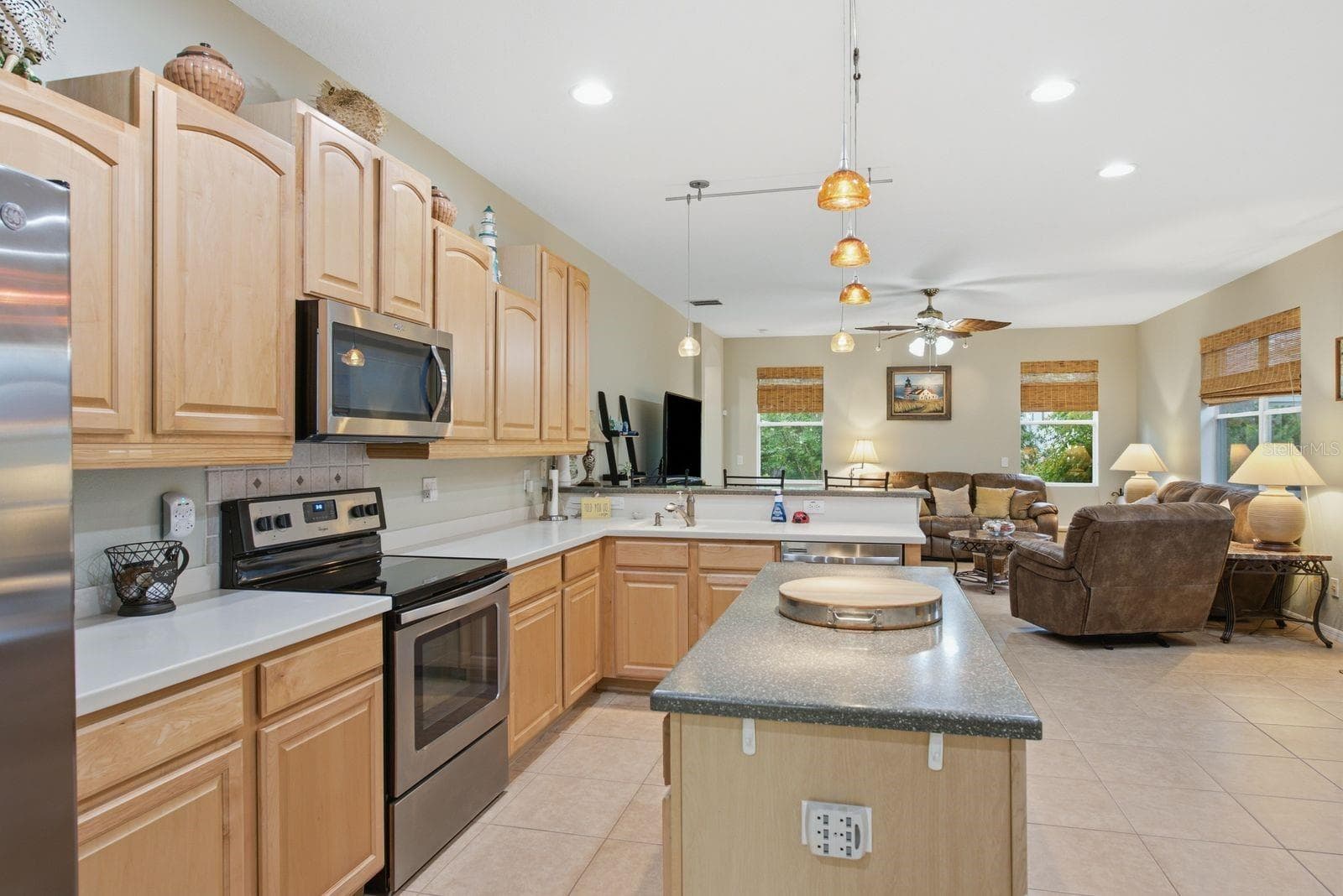 Corian countertops wood cabinets - 4882 W BREEZE CIR, PALM HARBOR