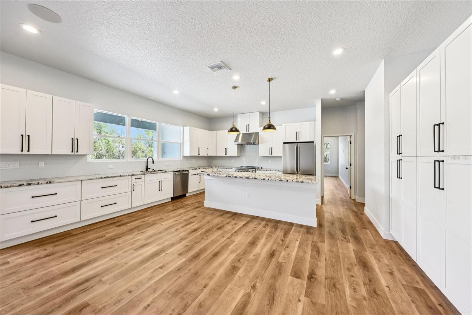 Lots of Draw bases with counter depth refrigerator and 36" stainless hood - 1623 MAGNOLIA AVE, DELAND