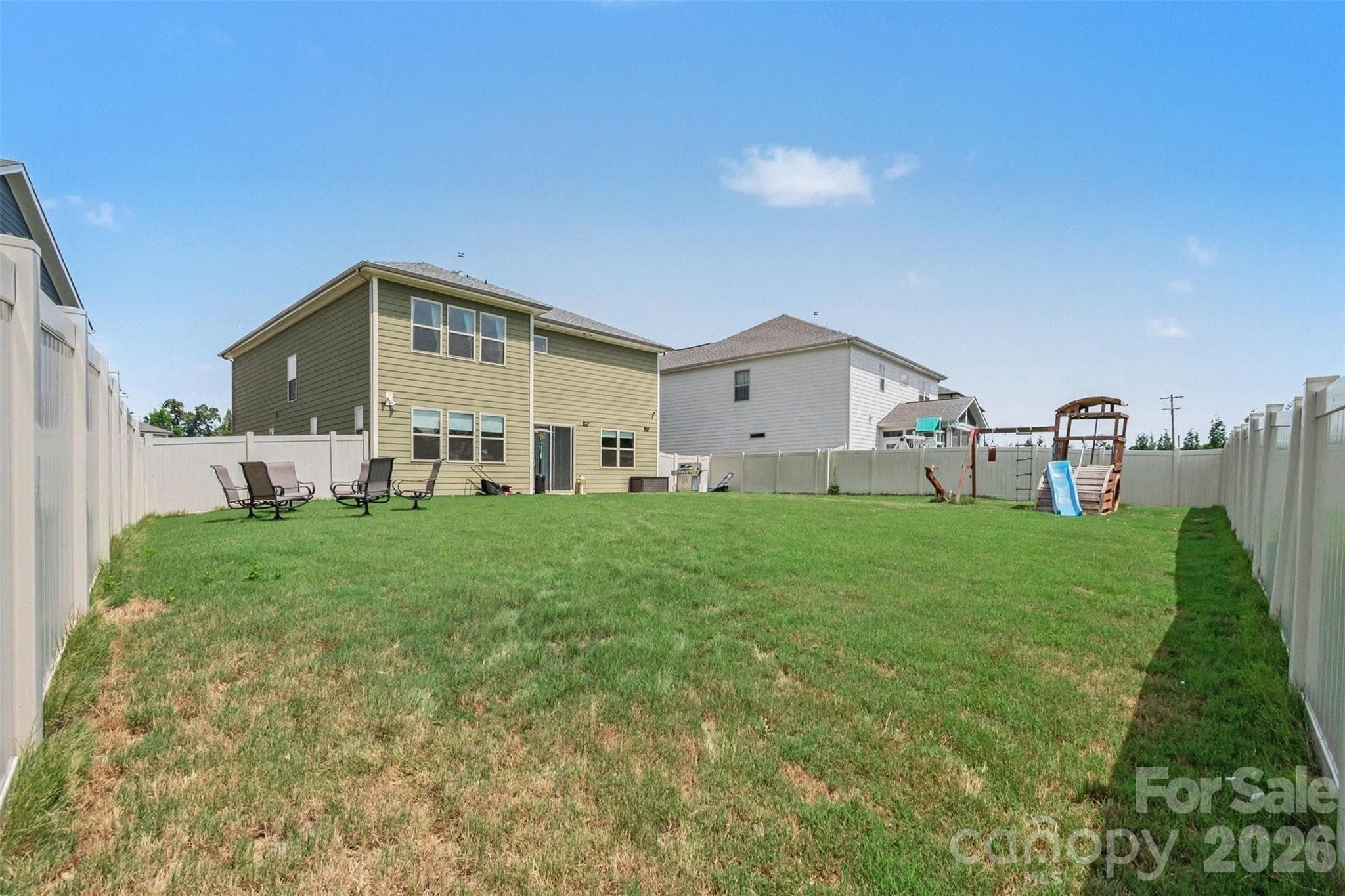 The giant, fully fenced back yard is perfect for play or anything your heart desires! - 2055 Yearden Lane, Monroe