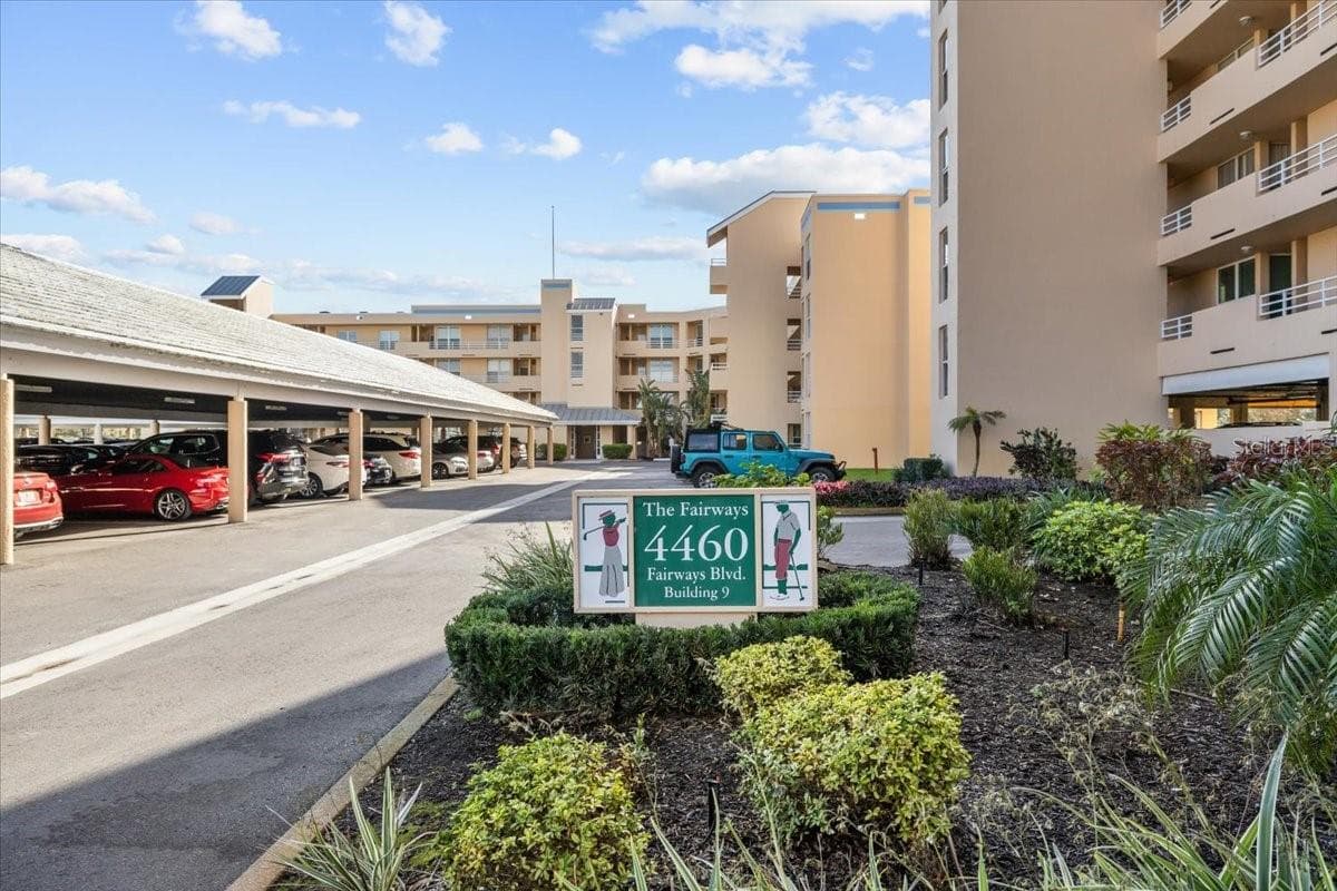 Just like a GARAGE. This home is one of very few in the neighborhood with UNDER BUILDING ASSIGNED parking. Never have to get wet in or out. Most units have carports. - 4460 FAIRWAYS BLVD #407, BRADENTON