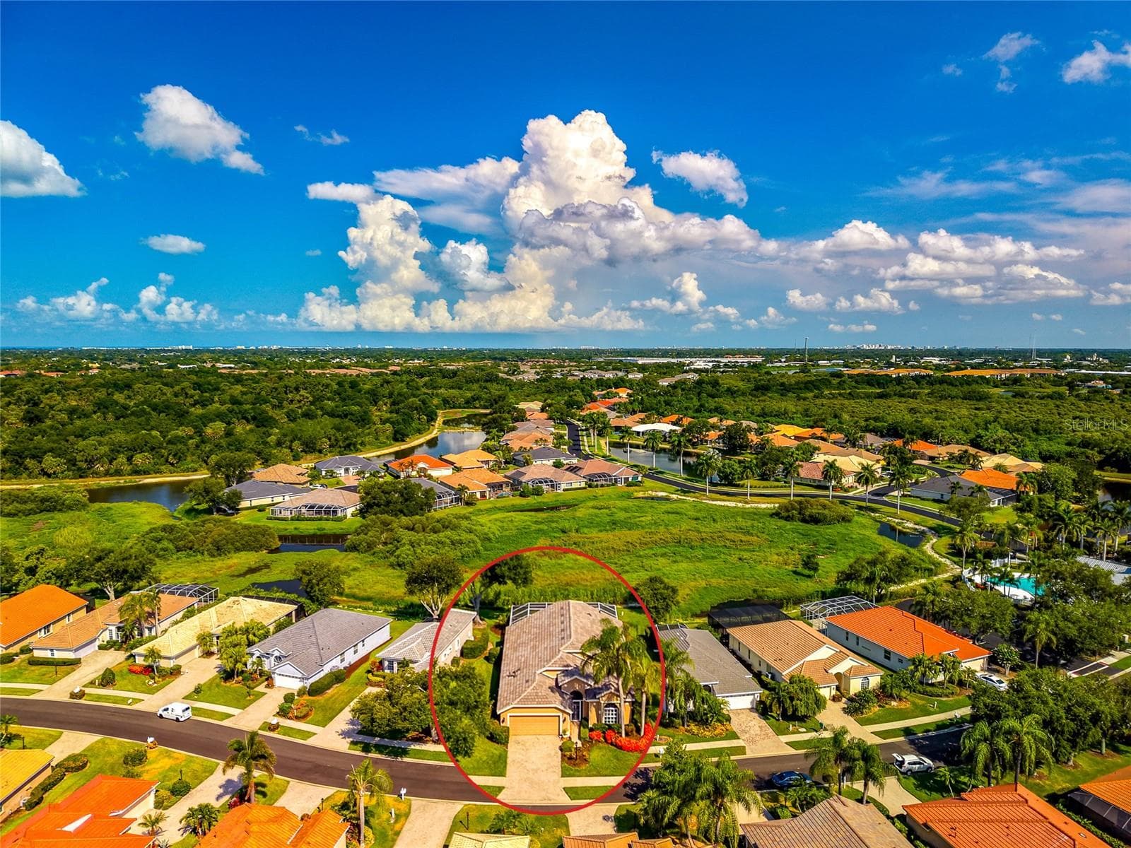 Drought a rarity; new rains restoring wet land area as next community pool photo shows. - 5133 FLAGSTONE DR, SARASOTA