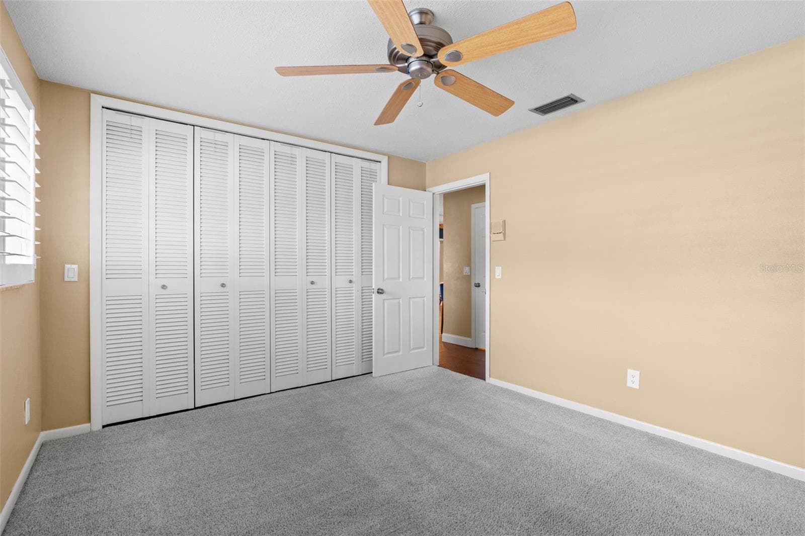 Bedroom 2 - ceiling fan and plantation shutters - 6729 TEQUESTA DR, SEMINOLE
