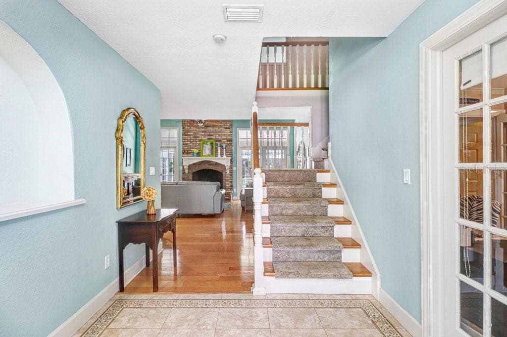 Custom Tile and Wood floors Foyer entrance - 1976 DUNLOE CIR, DUNEDIN