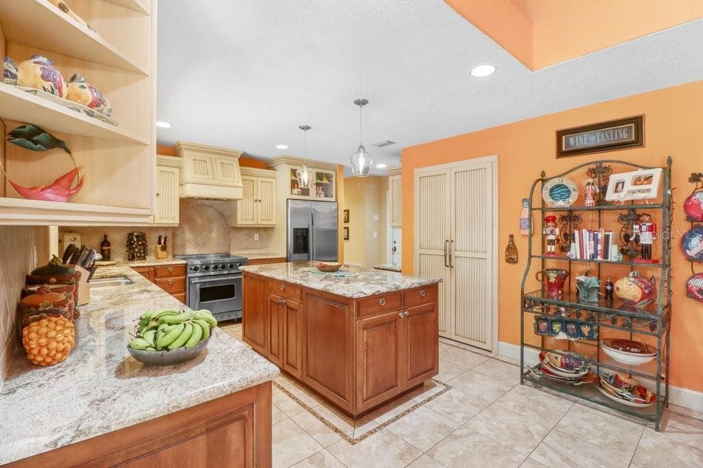 Another great view of the custom kitchen and pantry doors - 1976 DUNLOE CIR, DUNEDIN