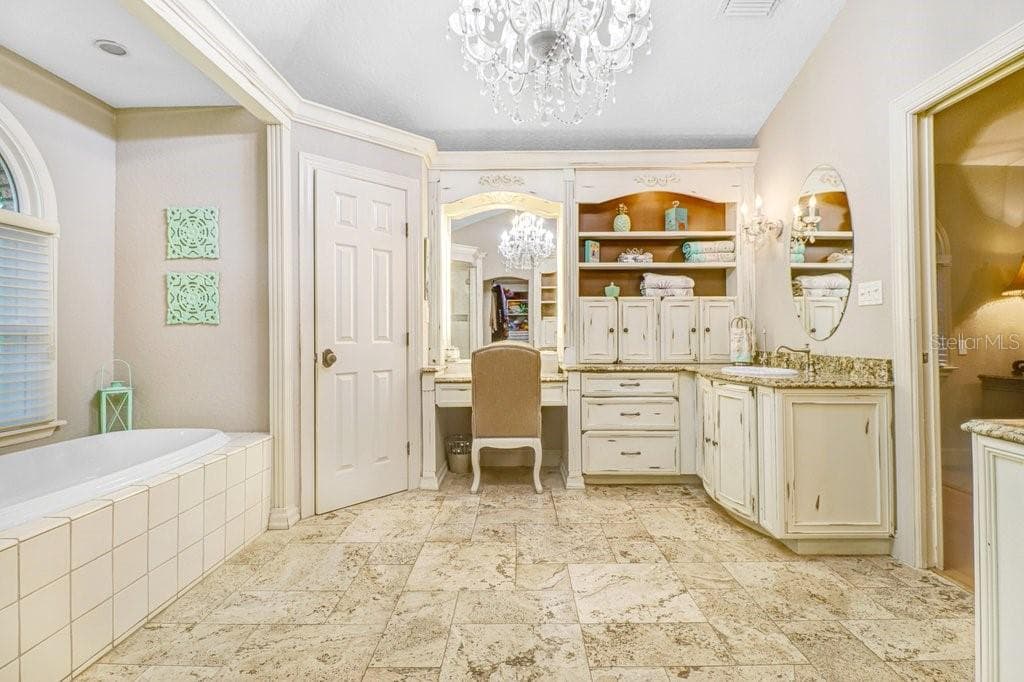 Another view of Master Bathroom with view of vanity area. - 1976 DUNLOE CIR, DUNEDIN