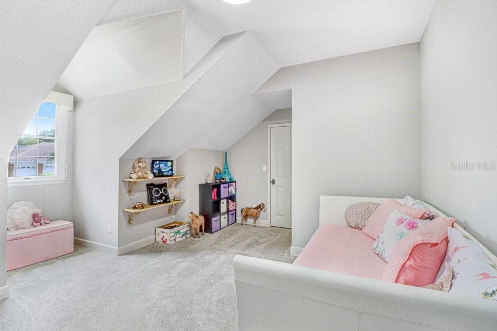Another view of bedroom with plenty of space and cool angled ceilings. - 1976 DUNLOE CIR, DUNEDIN
