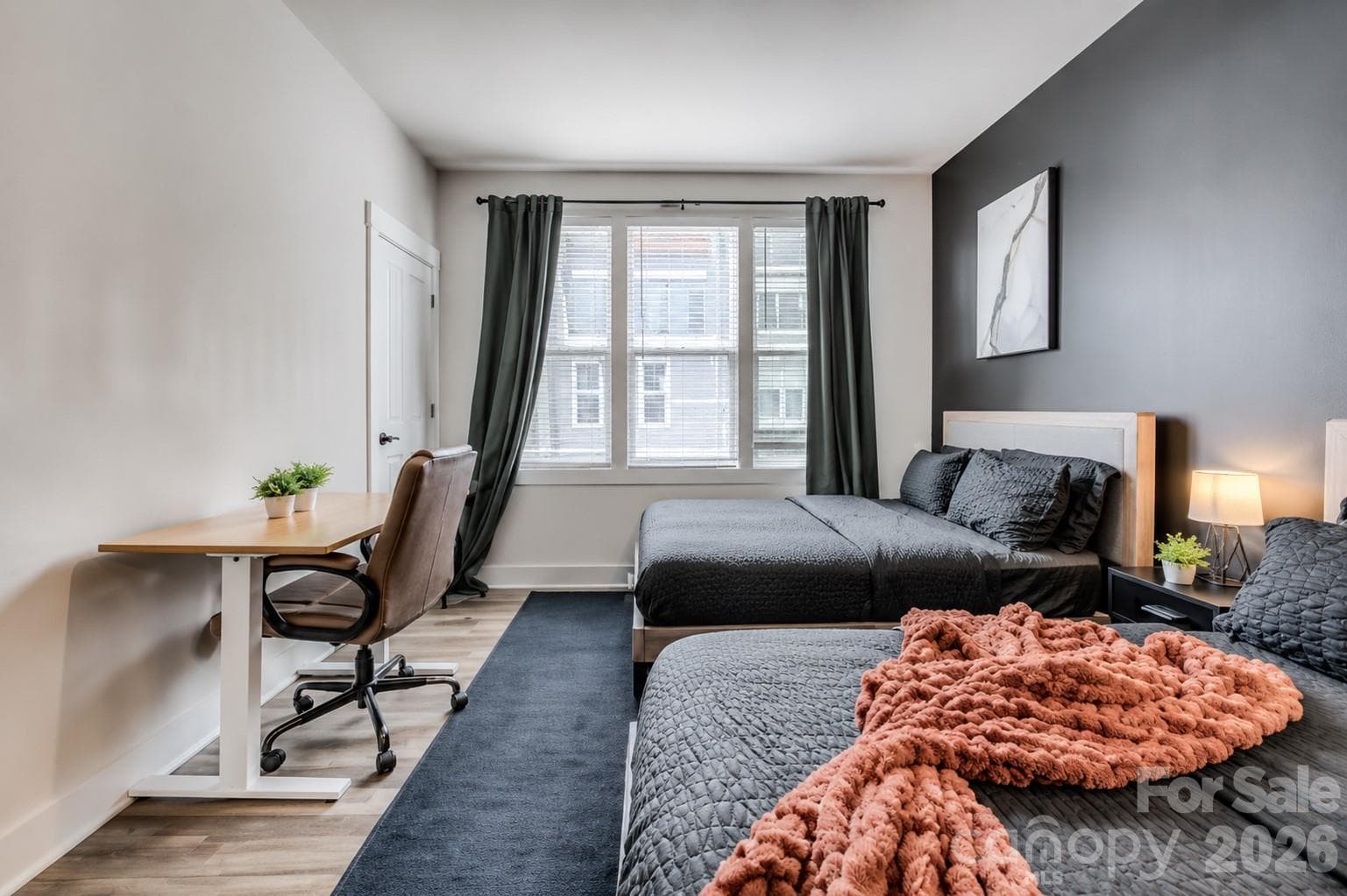 The spacious secondary bedroom offers abundant natural light, generous closet space, and room for multiple beds, making it ideal for guests, family, or a flexible home office setup. - 3019 Jolene Court, Charlotte