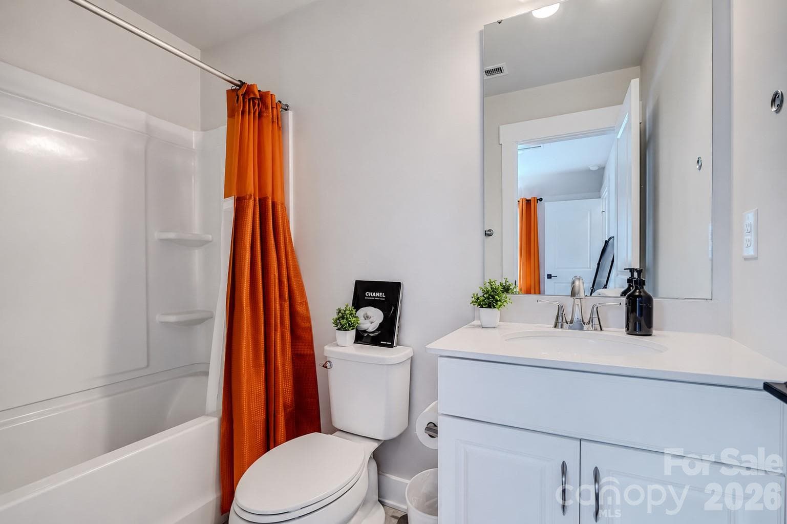 The spacious secondary bathroom features a large vanity, a tub/shower combination, and modern finishes, creating a functional space for family and guests. - 3019 Jolene Court, Charlotte