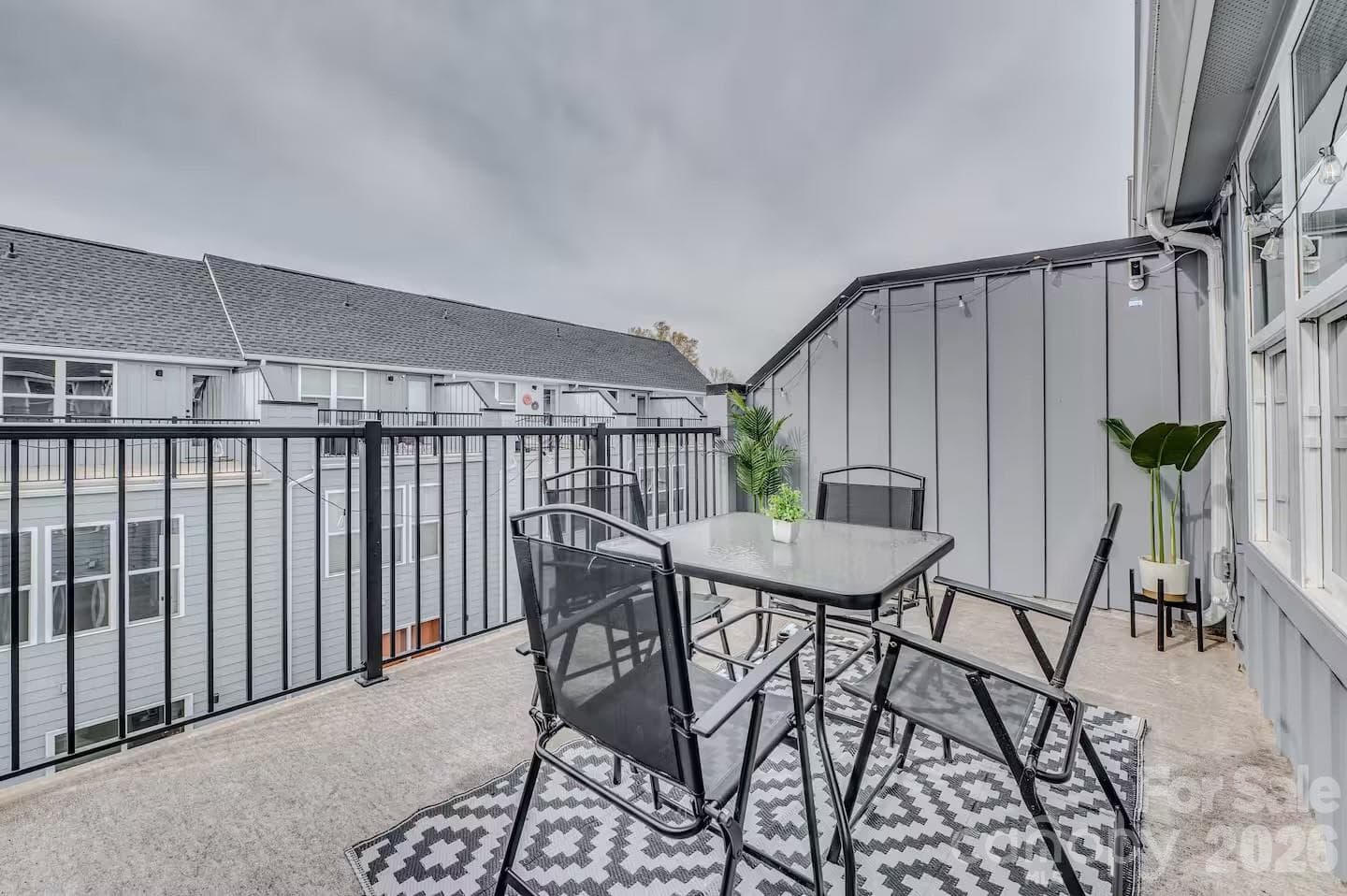 Enjoy outdoor living on the spacious private balcony, offering the perfect setting for morning coffee, evening relaxation, or entertaining guests in a low-maintenance setting. - 3019 Jolene Court, Charlotte