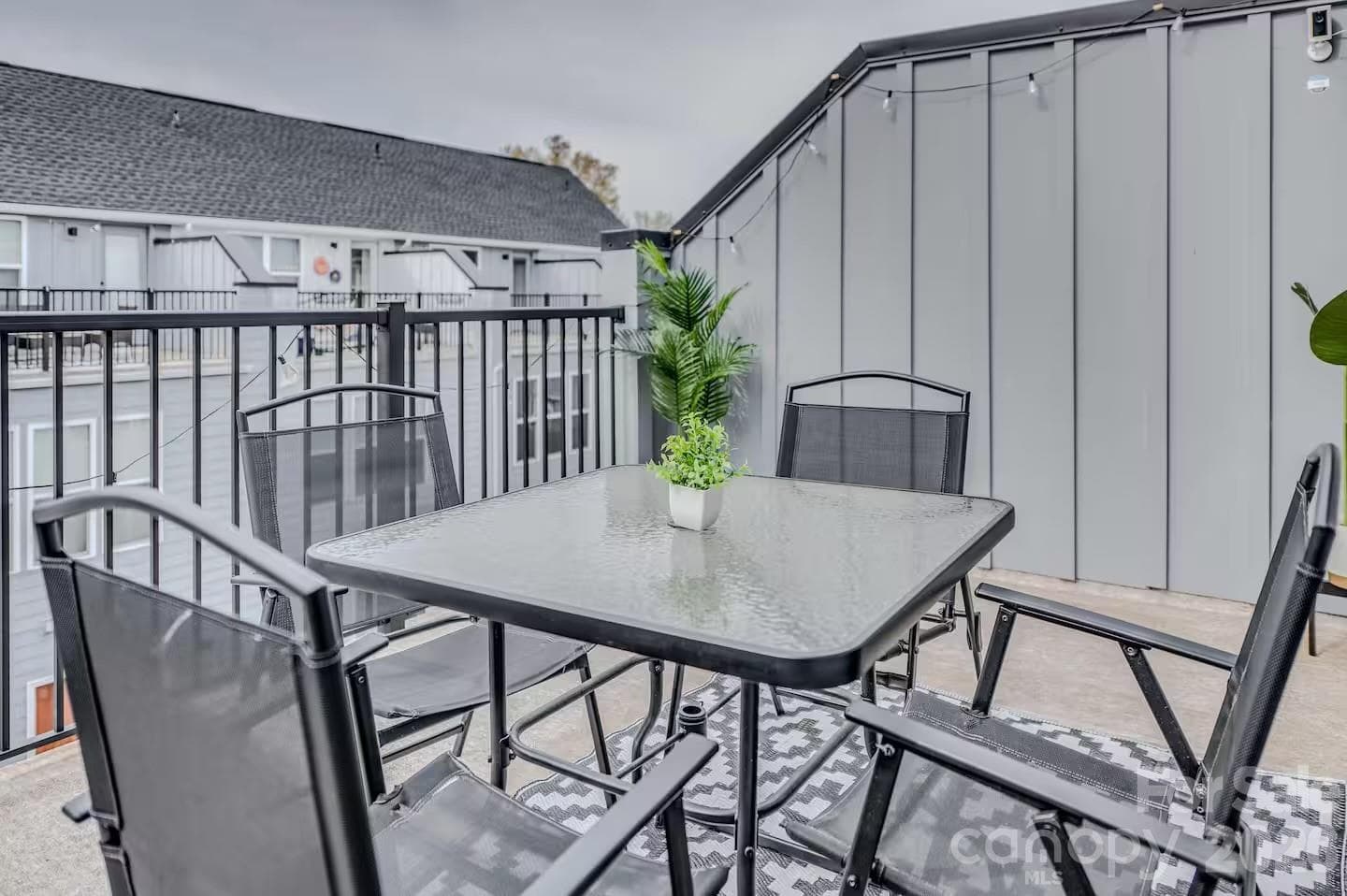 Enjoy outdoor living on the spacious private balcony, offering the perfect setting for morning coffee, evening relaxation, or entertaining guests in a low-maintenance setting. - 3019 Jolene Court, Charlotte