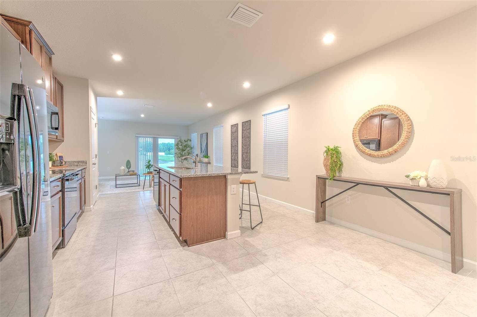 Kitchen view of Family Room by Refrigerator - 11836 BRISTOL BRIDGE RD, SPRING HILL