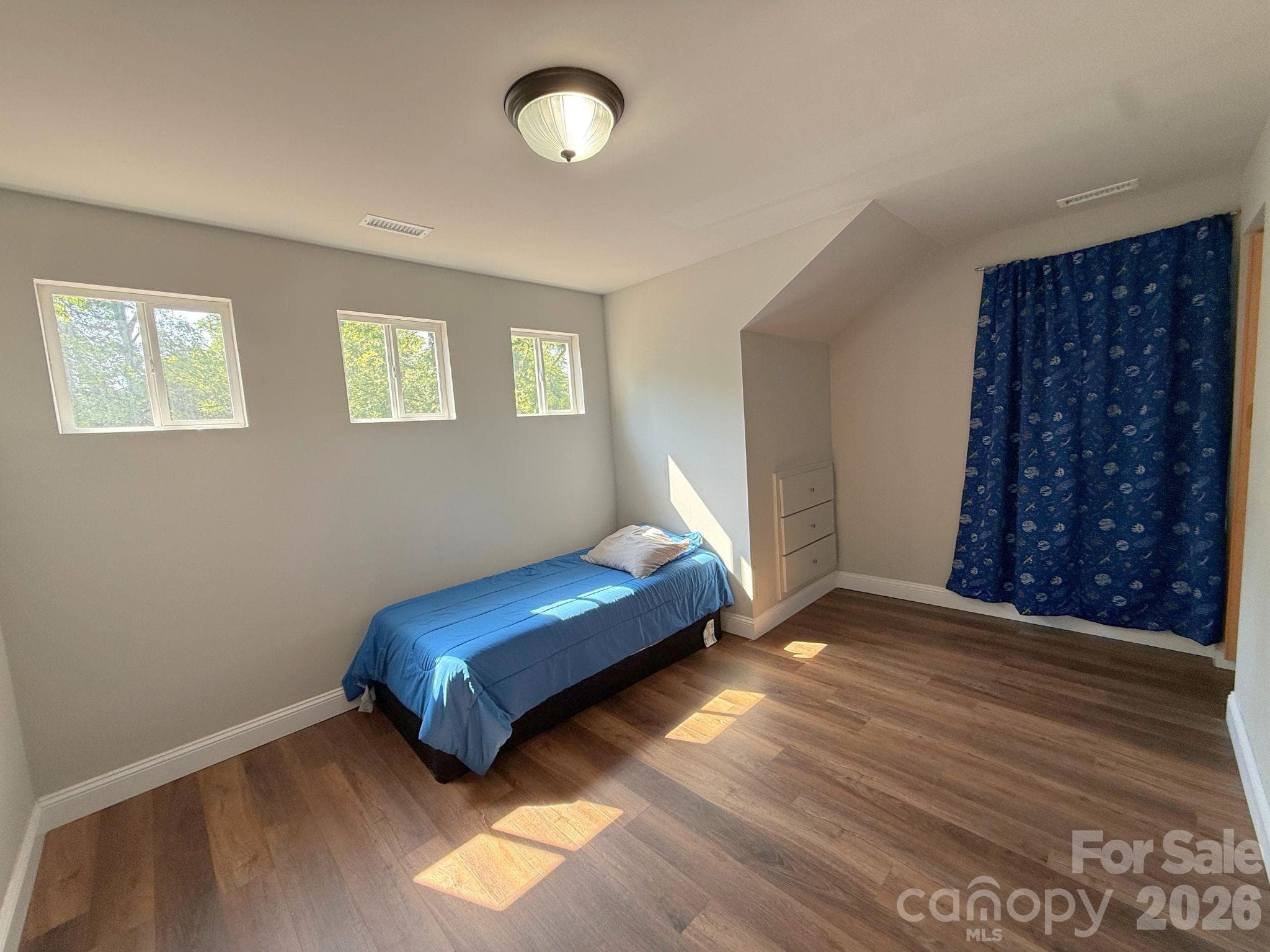 Upstairs Bedroom – Large secondary bedroom with abundant natural light, luxury vinyl plank flooring, and versatile space to accommodate a variety of needs. - Chester
