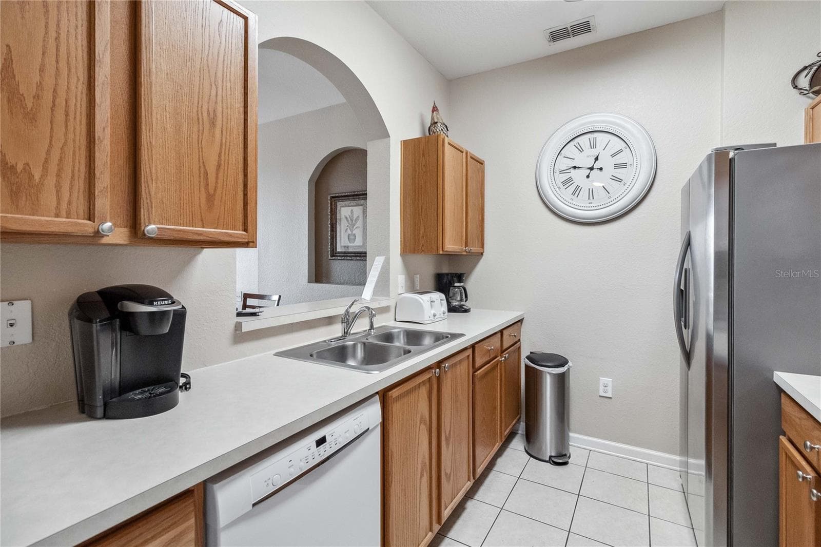 Another view of kitchen showing opening wall to dining area. - 2821 E ALMATON LOOP #401, KISSIMMEE