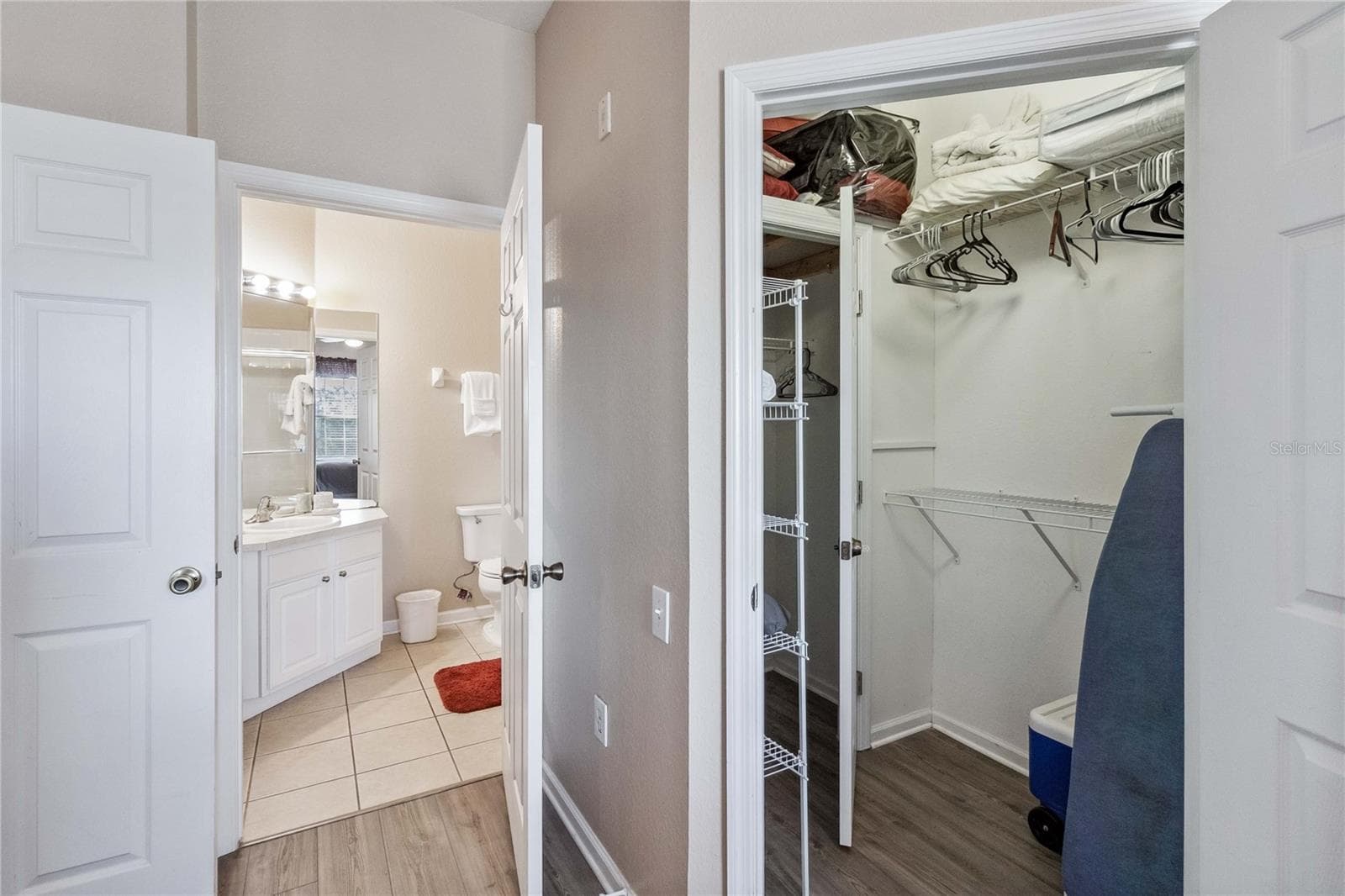 Master Bedroom walk-in closet and Master Bathroom. - 2821 E ALMATON LOOP #401, KISSIMMEE