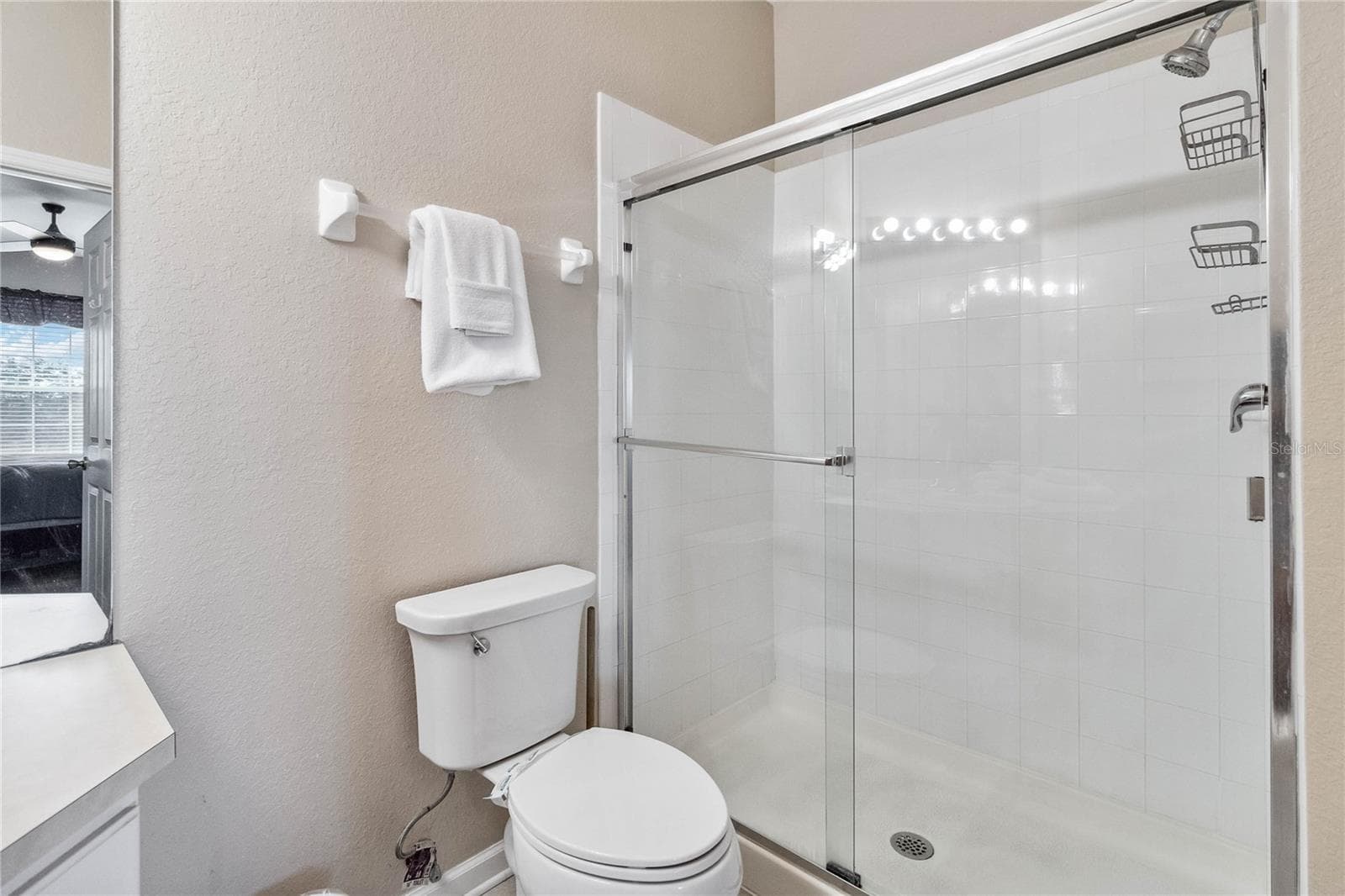 Master Bathroom showing shower enclosure. - 2821 E ALMATON LOOP #401, KISSIMMEE