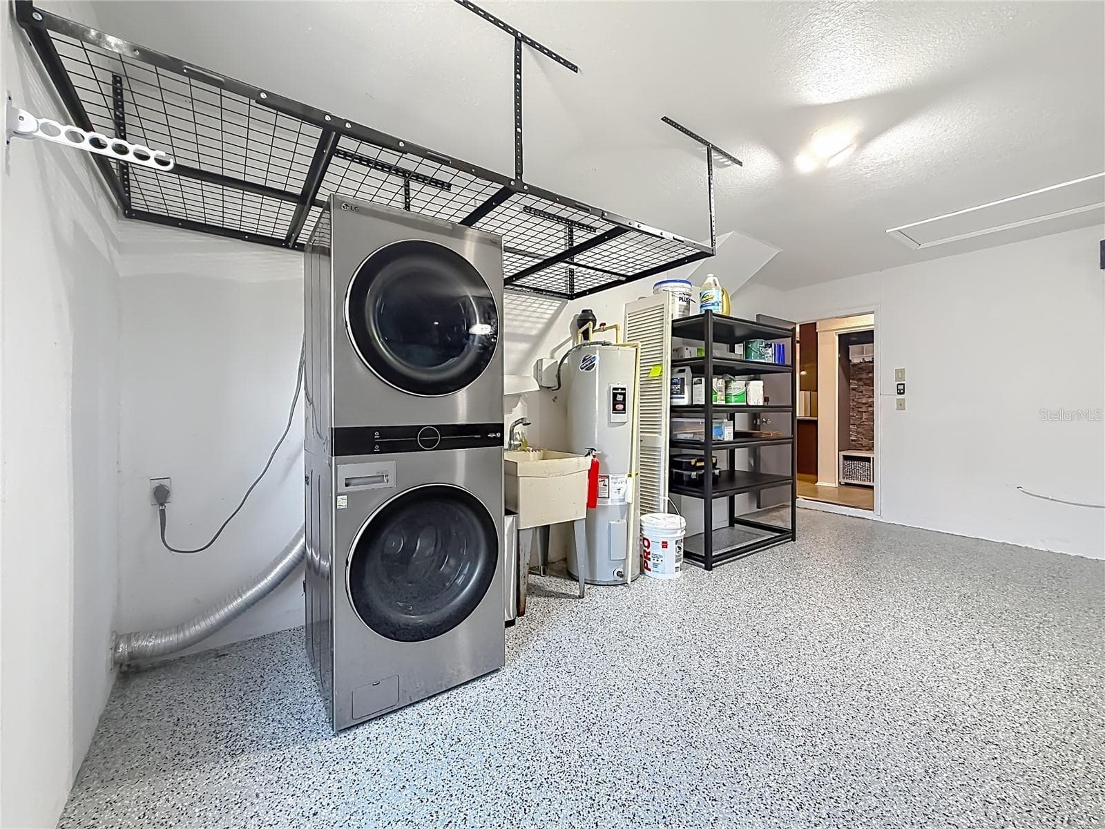 Garage with Laundry Area and Storage - 2632 CAMILLE DR, PALM HARBOR