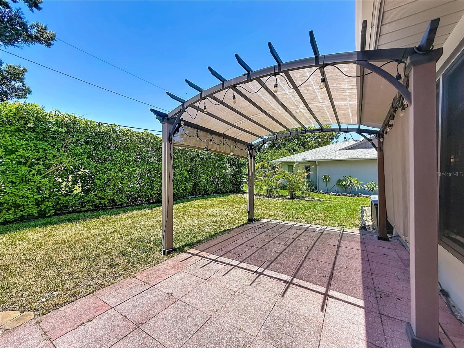 Pergola overlooking Rear Green Space - 2632 CAMILLE DR, PALM HARBOR