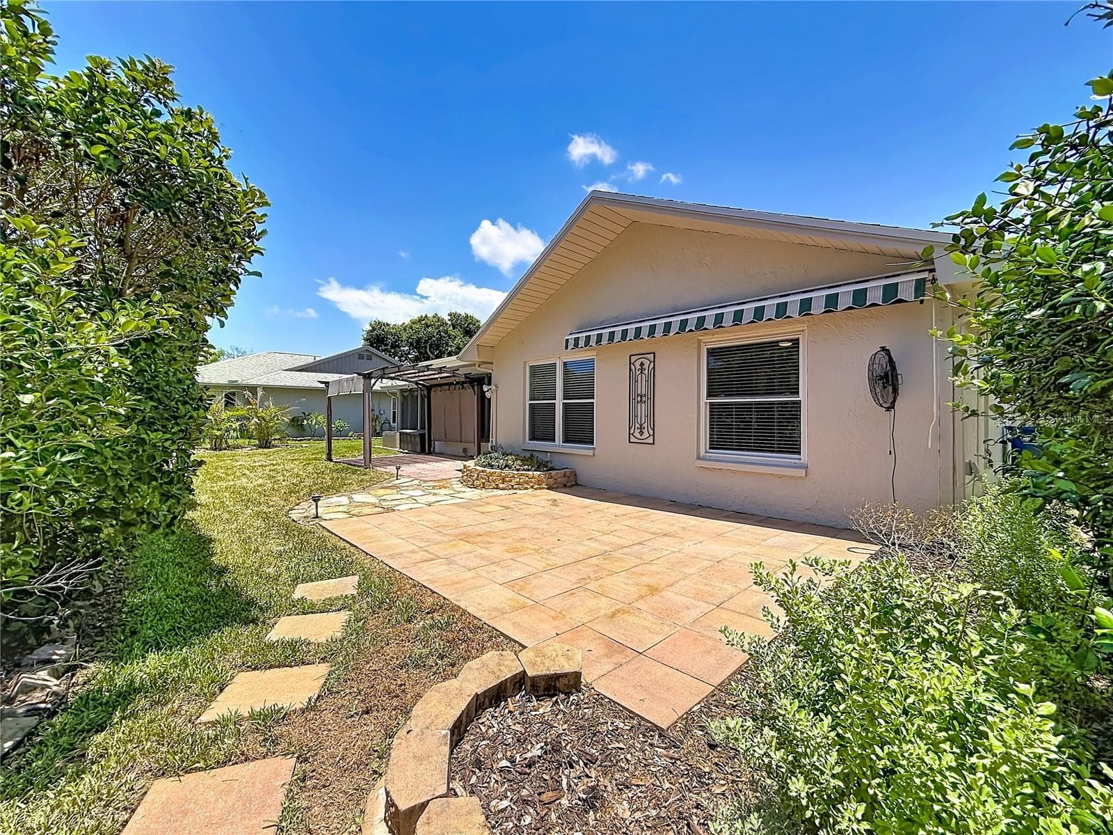 Patio overlooking Rear Green Space and Succulent Bed - 2632 CAMILLE DR, PALM HARBOR