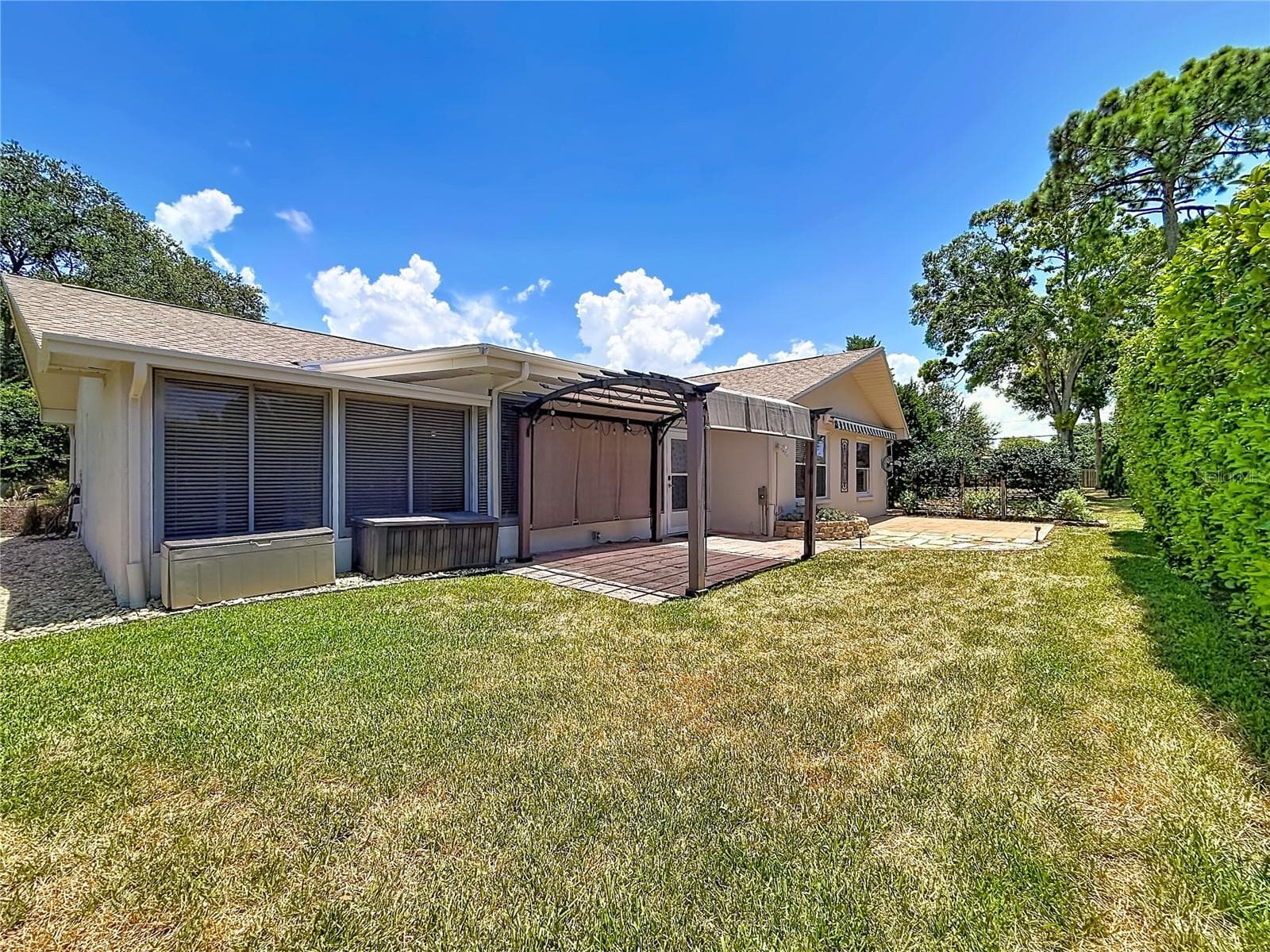 Rear Green Space and Outdoor Living Area - 2632 CAMILLE DR, PALM HARBOR