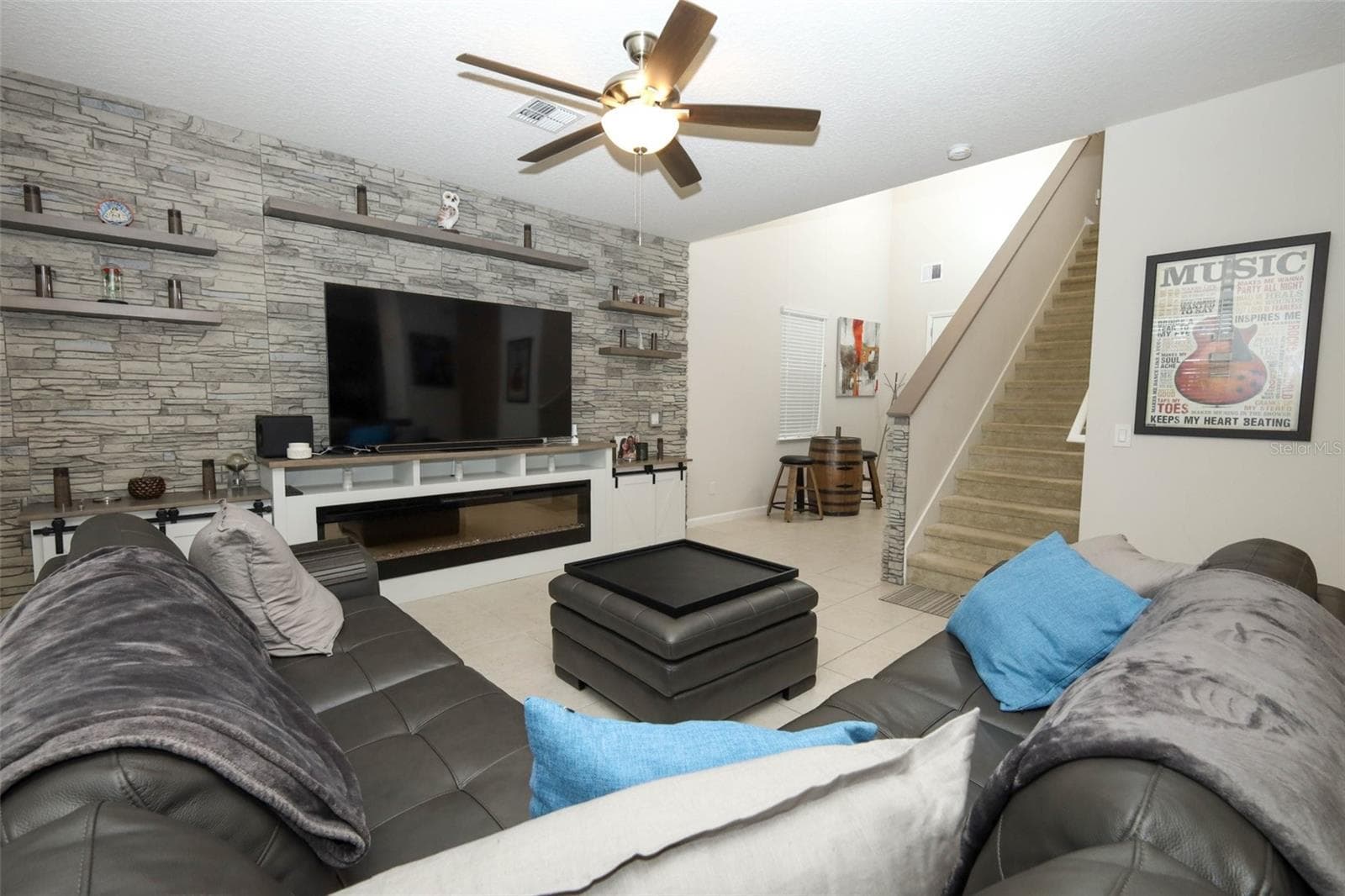 Great room / Custom built entertainment center / electric fireplace - 3980 LIGHTNING CT, SANFORD