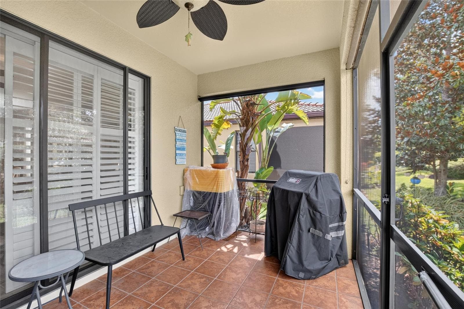 Tiled lanai - 342 BLUEWATER FALLS CT, APOLLO BEACH