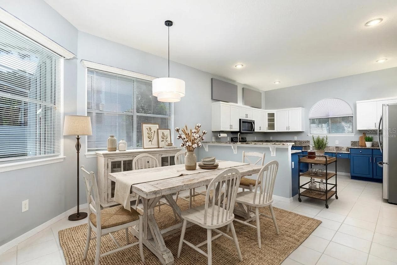 Virtually staged dining area in kitchen - 1153 OAK TREE CIR, ALTAMONTE SPRINGS