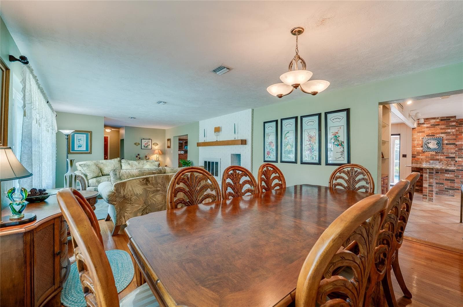 Living and dining showing kitchen to right - 697 JOHN ANDERSON DR, ORMOND BEACH