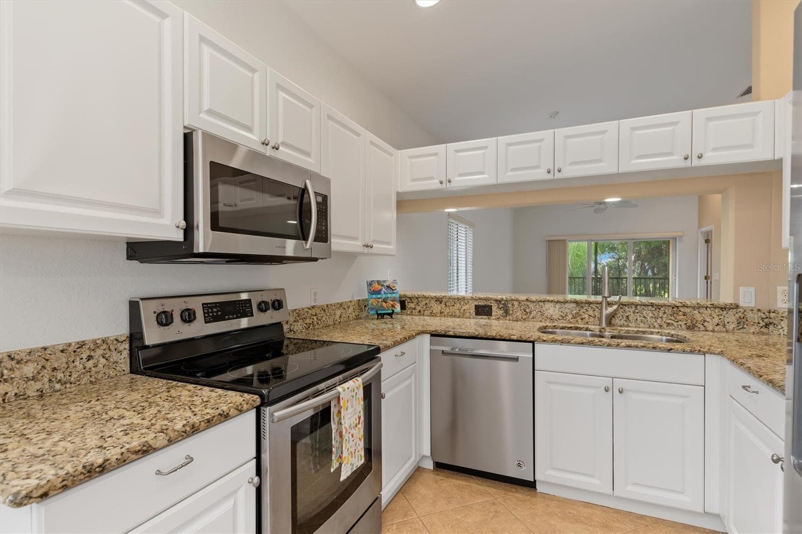Kitchen has granite and stainless - 7196 N PLUM TREE #321, PUNTA GORDA