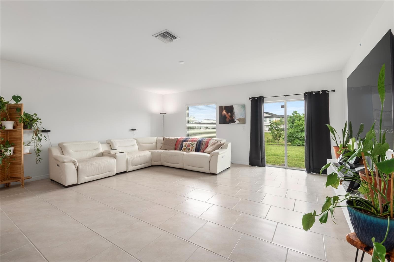 Open-concept great room designed for entertaining with abundant natural light and flexible living space. - 17177 MONTE ISOLA WAY, NORTH FORT MYERS