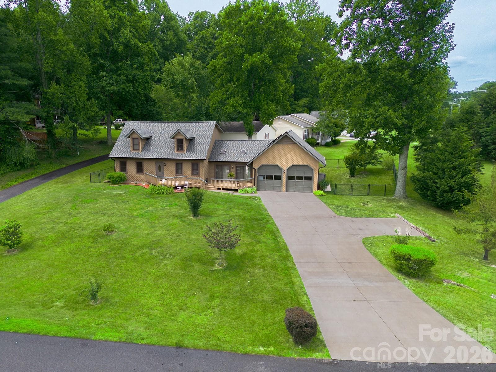 Oversized garage and additional parking pad in driveway - Hendersonville