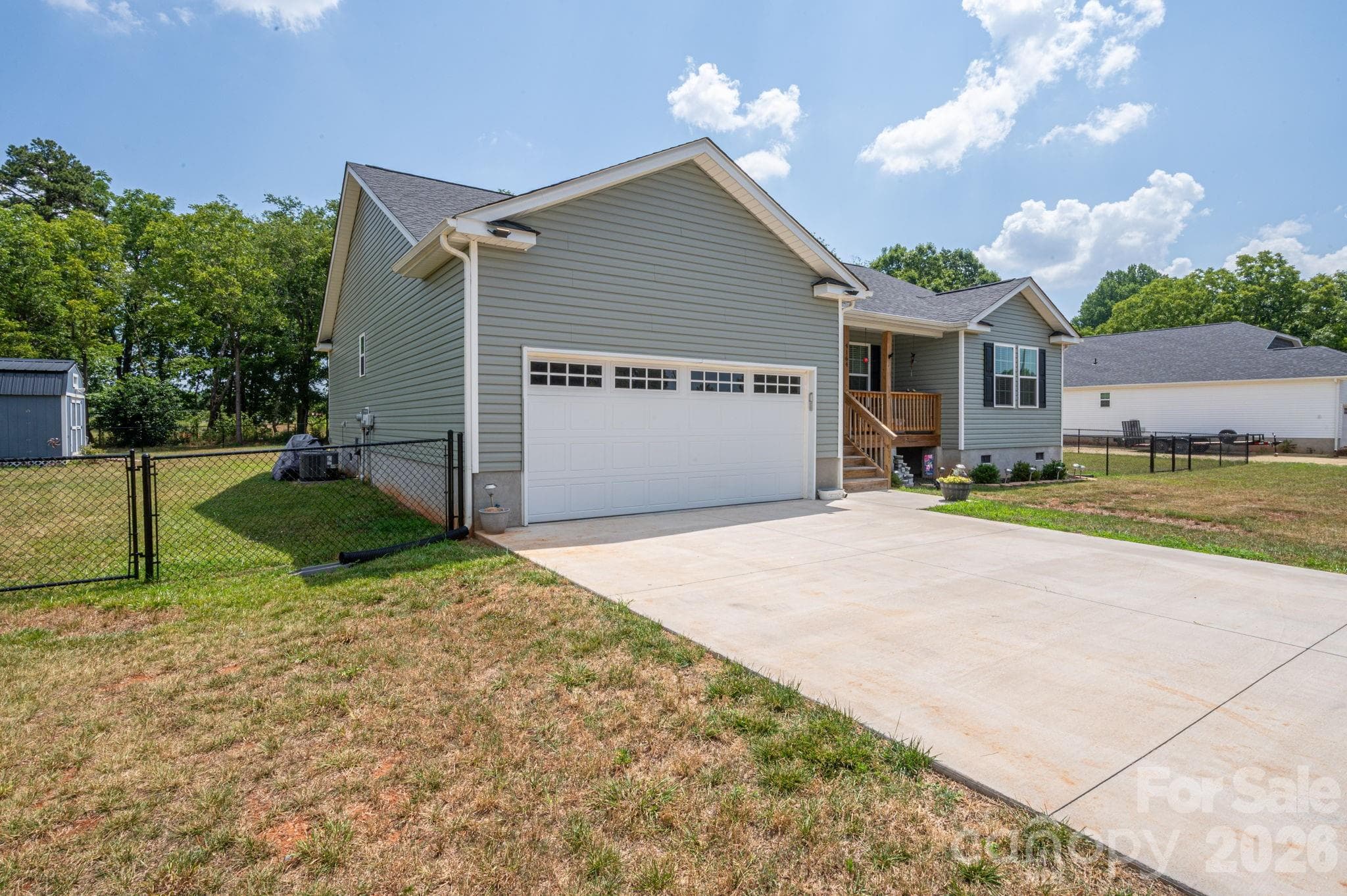 View of side yard and double gated fence - Newton
