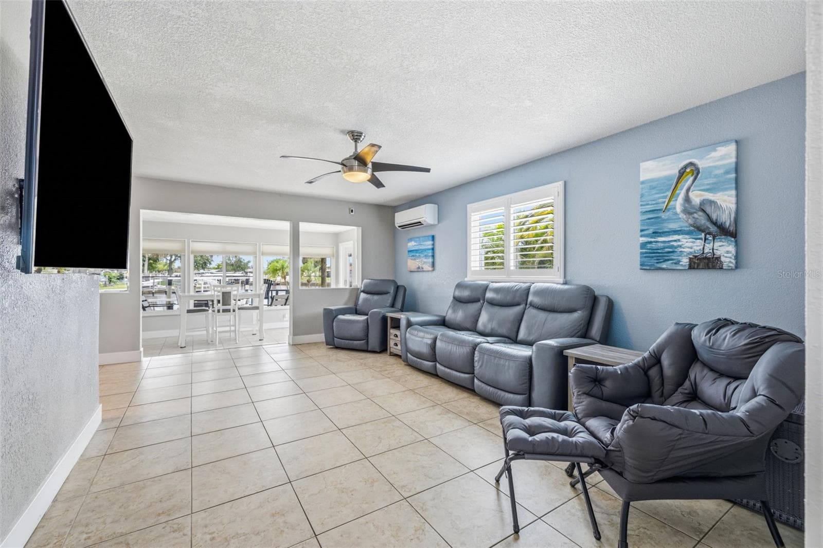 Cool coastal colors throughout the home! Large format 18" tiles in the living room, kitchen and dining room. - 4320 FLORAMAR TER, NEW PORT RICHEY