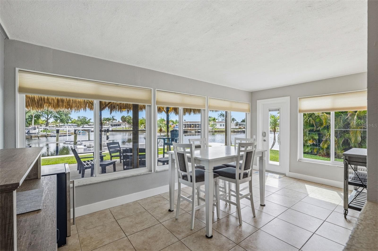 Bonus Area! Perfect for an additional lounging area or dining area overlooking the backyard! Featuring Hurricane rated, impact/resistant windows and doors! - 4320 FLORAMAR TER, NEW PORT RICHEY