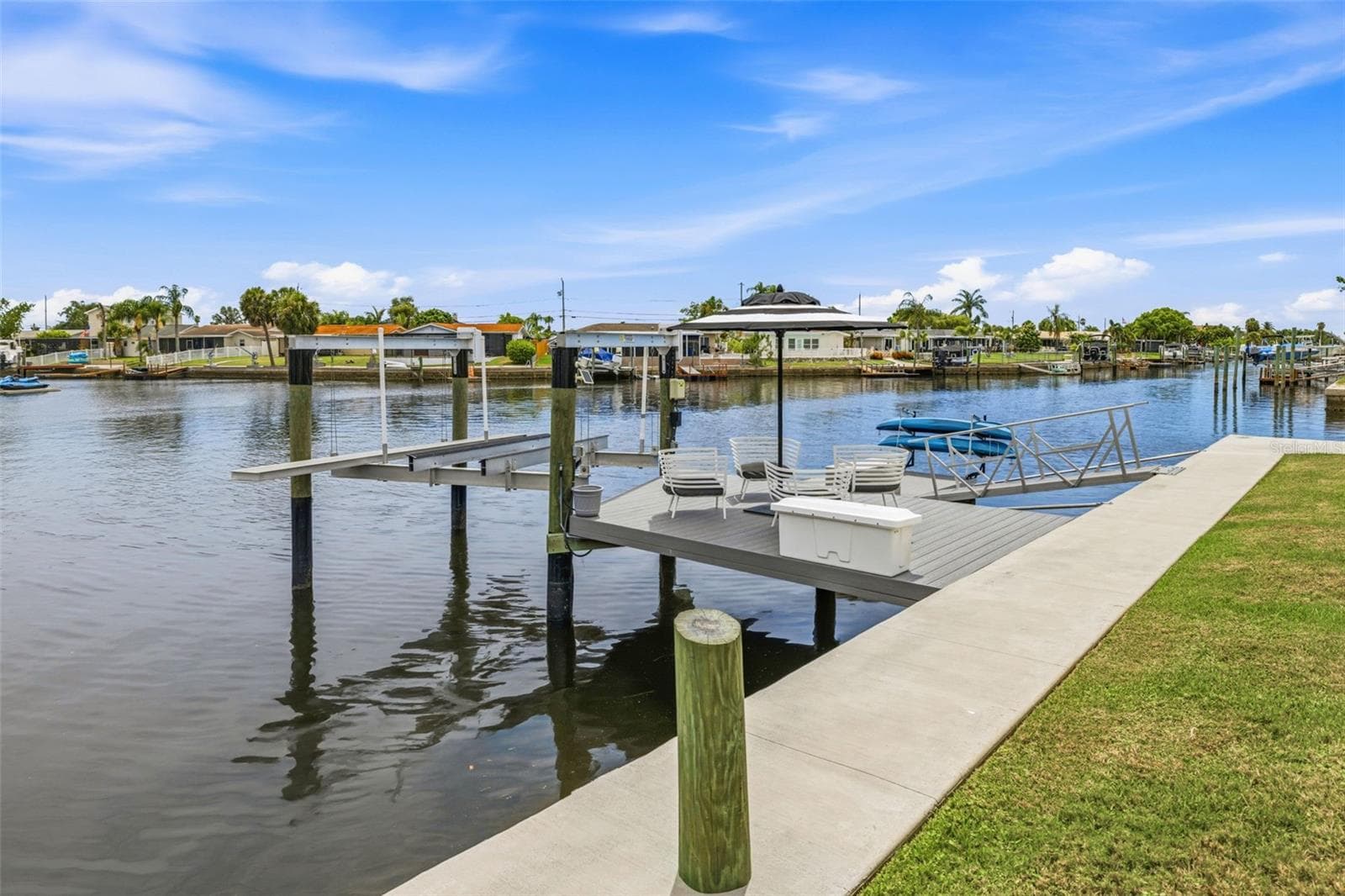 2023 - New Docks! Deck walk-out to the 10,000 lb boat lift including water and electric! Also a new Floating Dock w/Kayak Storage! - 4320 FLORAMAR TER, NEW PORT RICHEY
