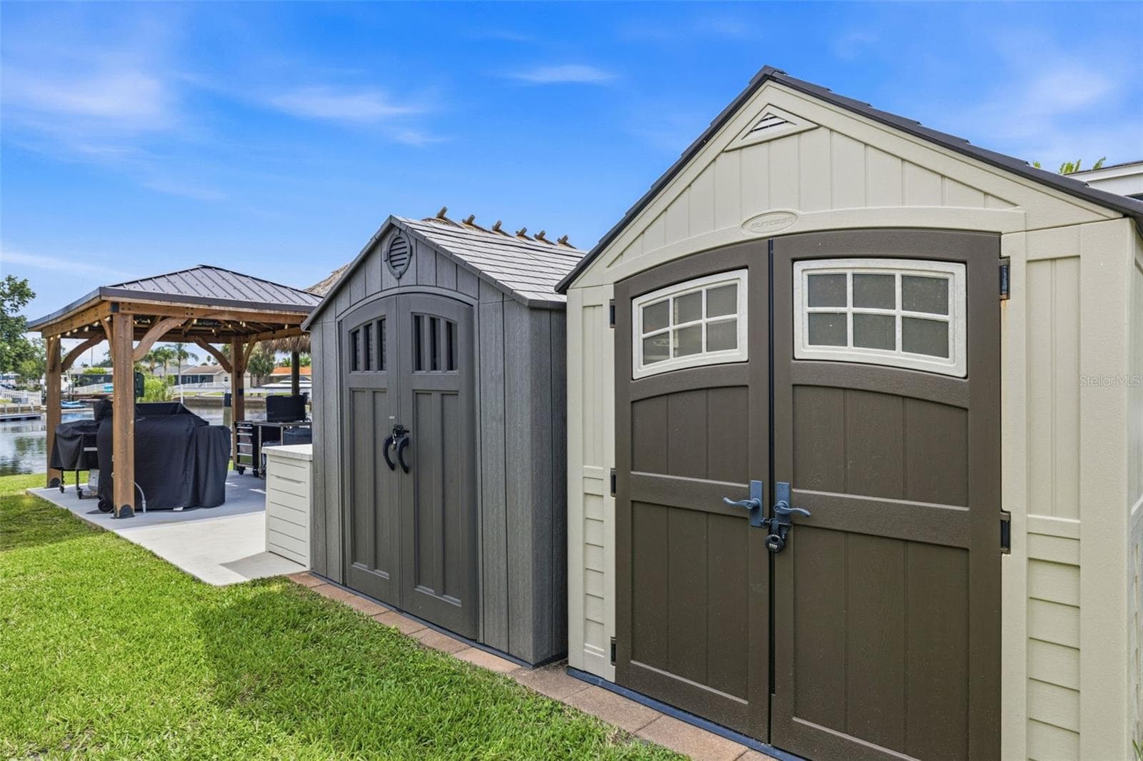 The home includes multiple storage areas, including these two storage and additional storage bins located around the property. - 4320 FLORAMAR TER, NEW PORT RICHEY