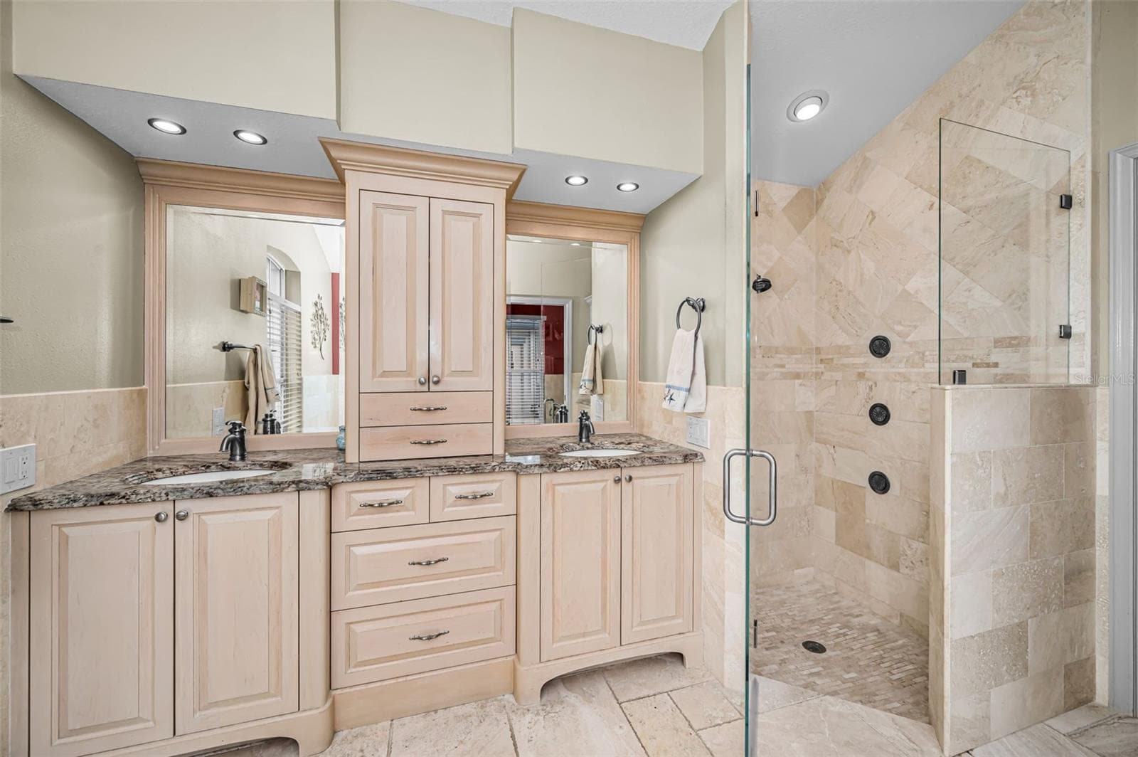 Primary bathroom with dual vanities and glass enclosed shower - 4084 LIGUSTRUM DR, PALM HARBOR